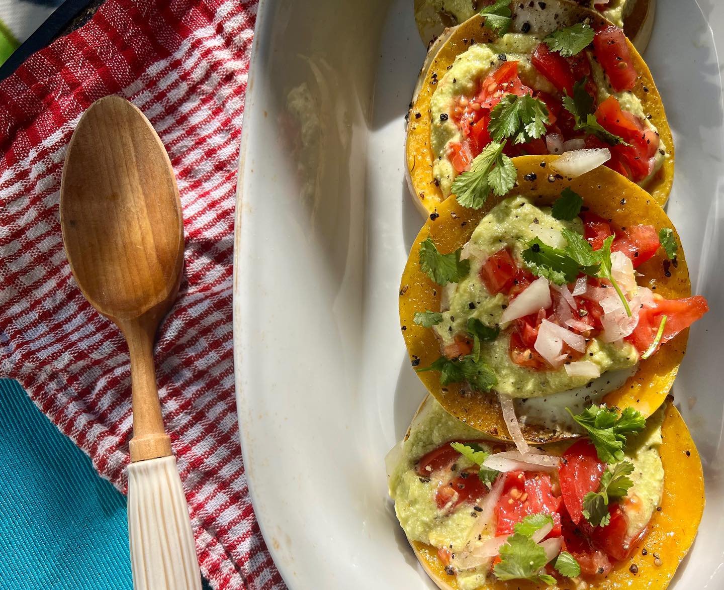 Saut&eacute;ed squash disks filled with local eggs, homemade goat cheese avocado crema topped with fresh cilantro, tomato, and onion. Goat cheese avo crema made with raw goat milk, lemon, and vinegar then creamed with avocado and olive oil. 

.
.
.
.