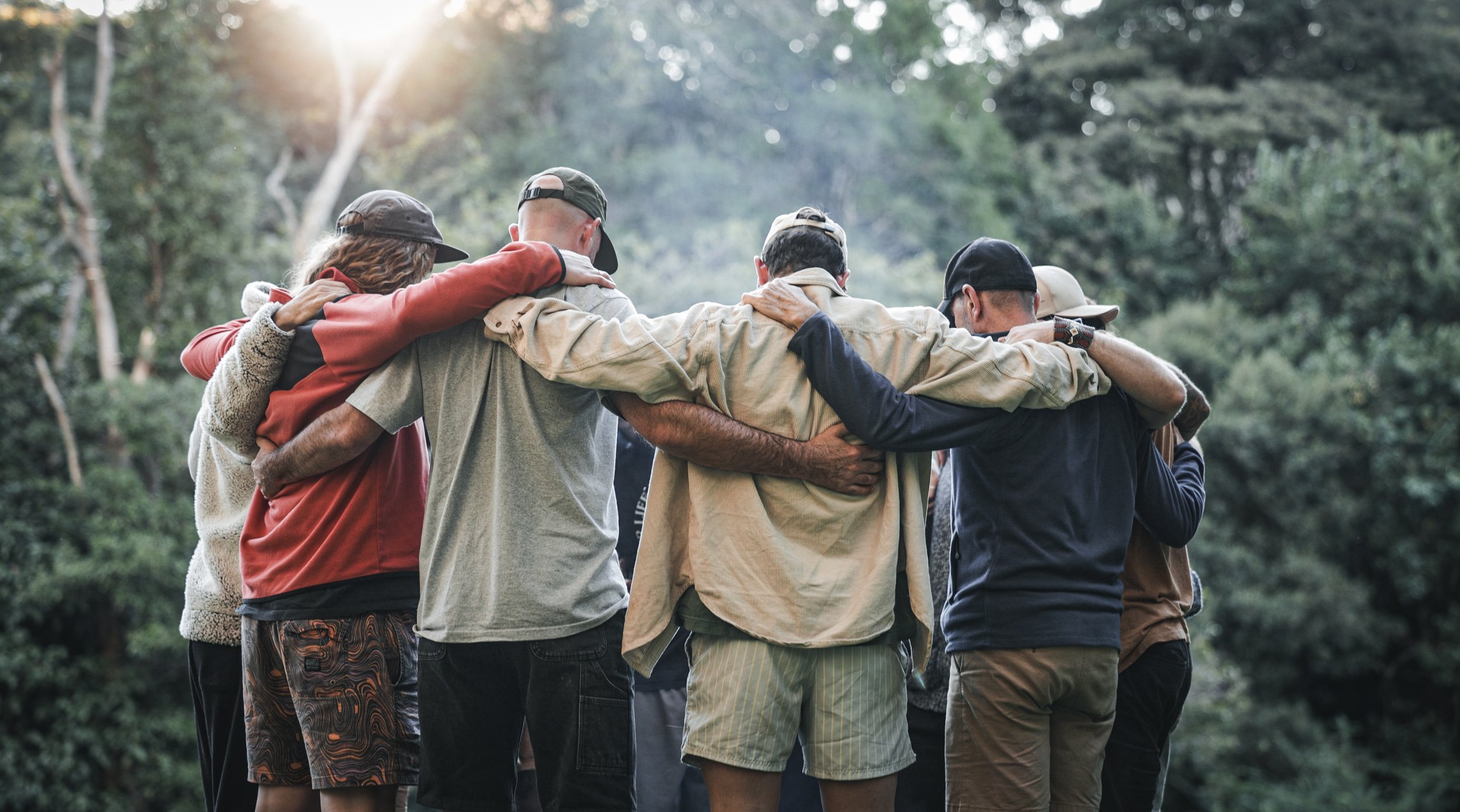 True North Mens Retreat - Men hugging & banding together. Brothers in arms.