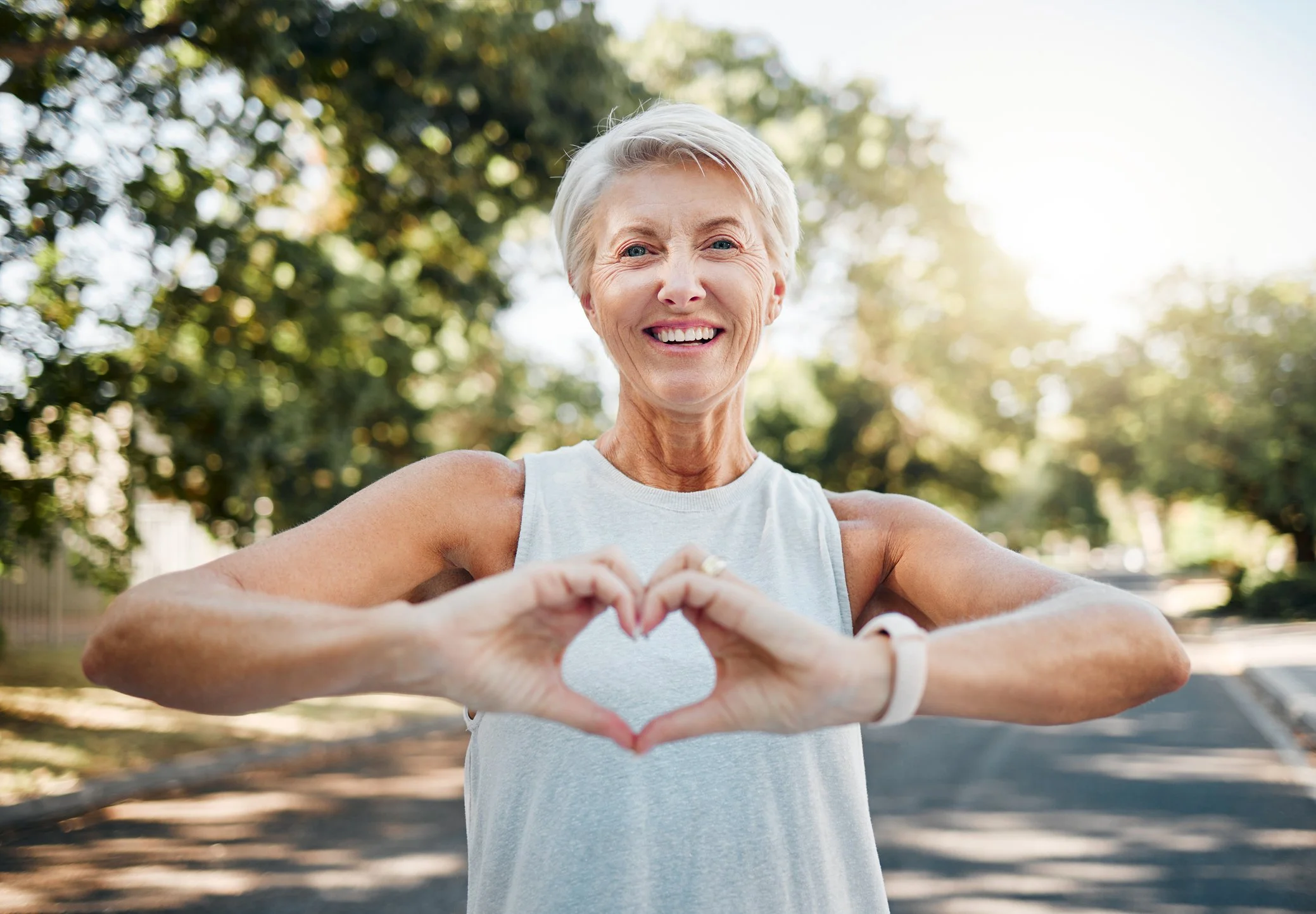 Active elderly woman enjoying outdoor exercise in Ballarat, supported independent living and aged care lifestyle.
