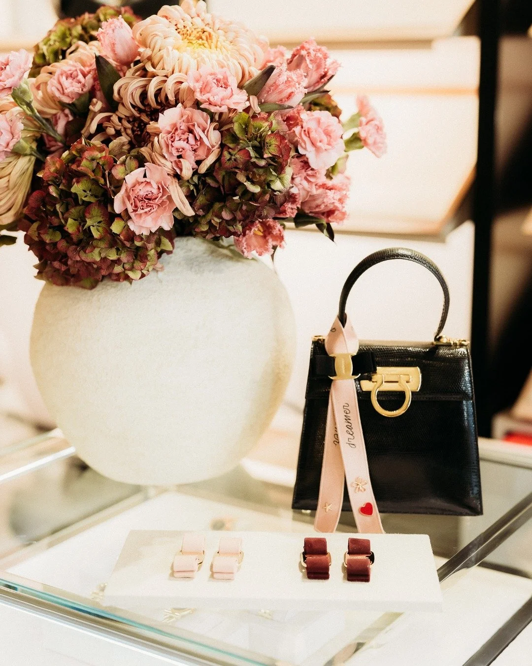 Ferragamo invites clients to discover the iconic Vara shoe through an exclusive in-store experience. Guests are welcomed to create their own personalised charm, selecting from colourful bows and ribbons and embellishing them with precious brooches&md