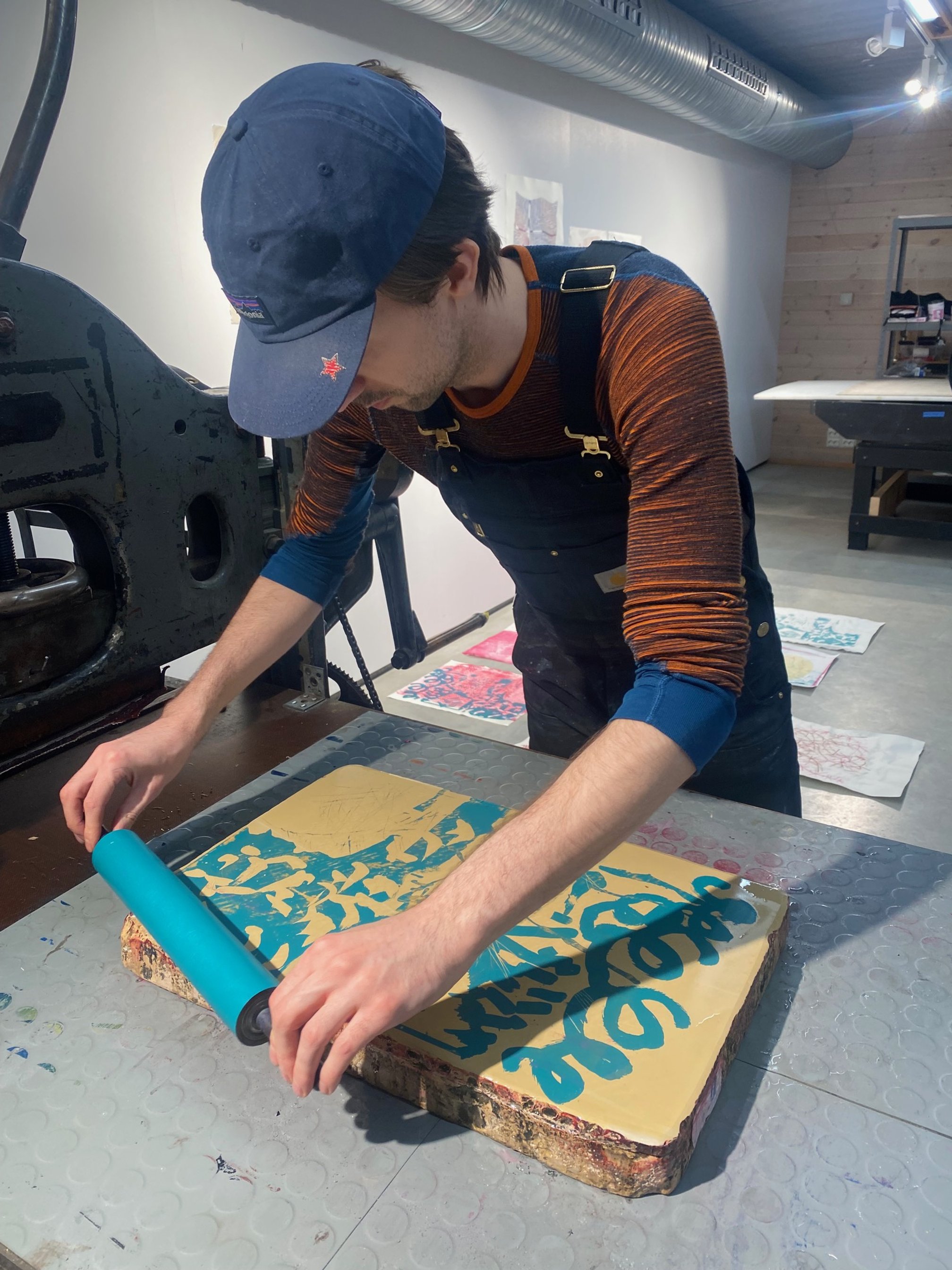 Kamil Kak working with litography