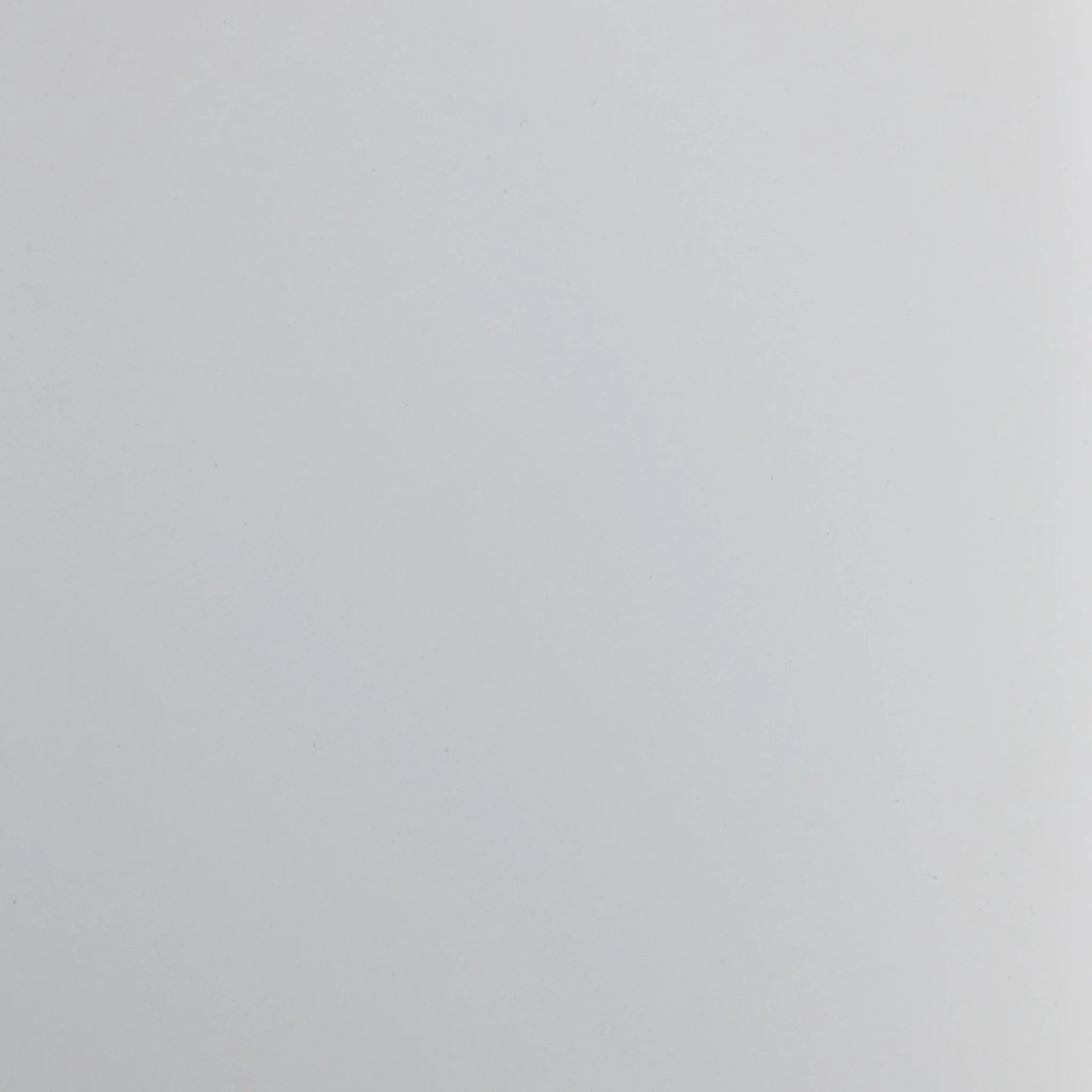 A blank, light gray background with no distinguishable objects.