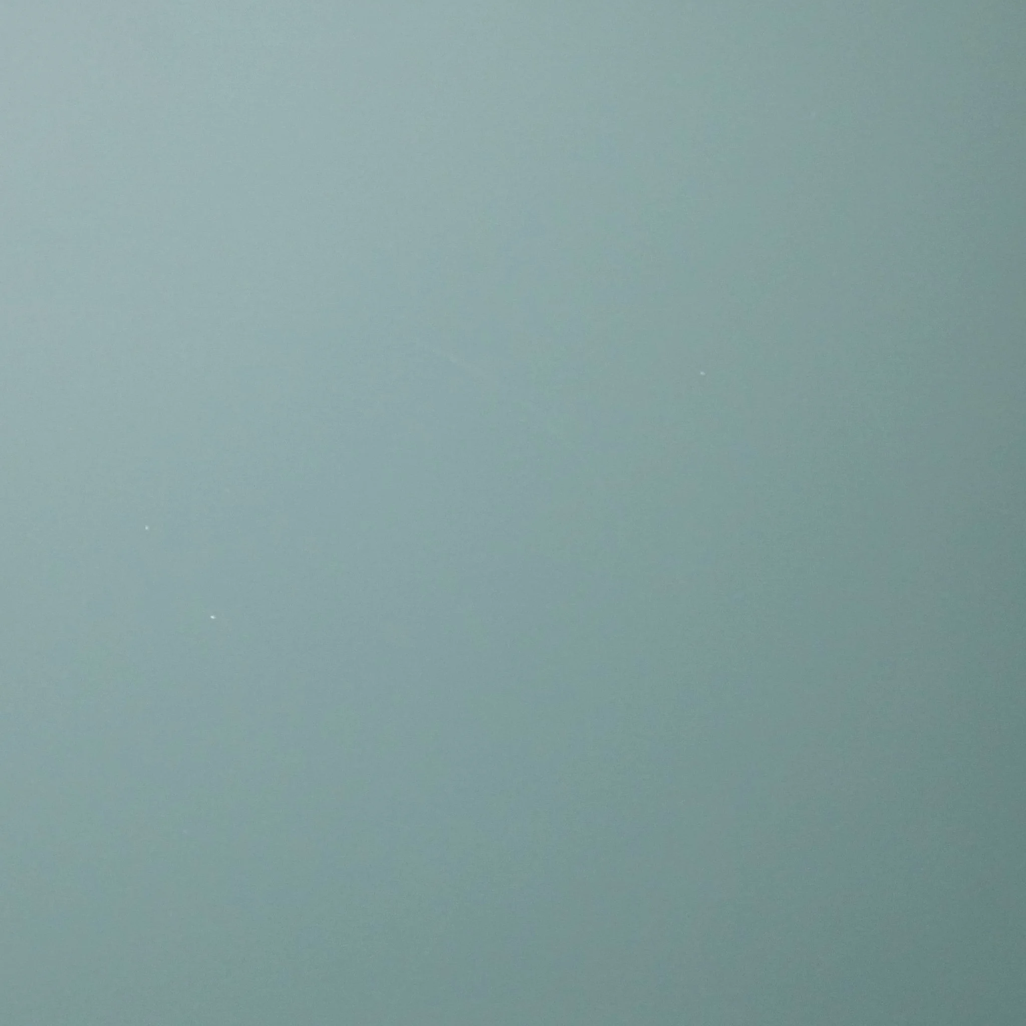 A plain, smooth surface with a gradient of light blue to darker blue.