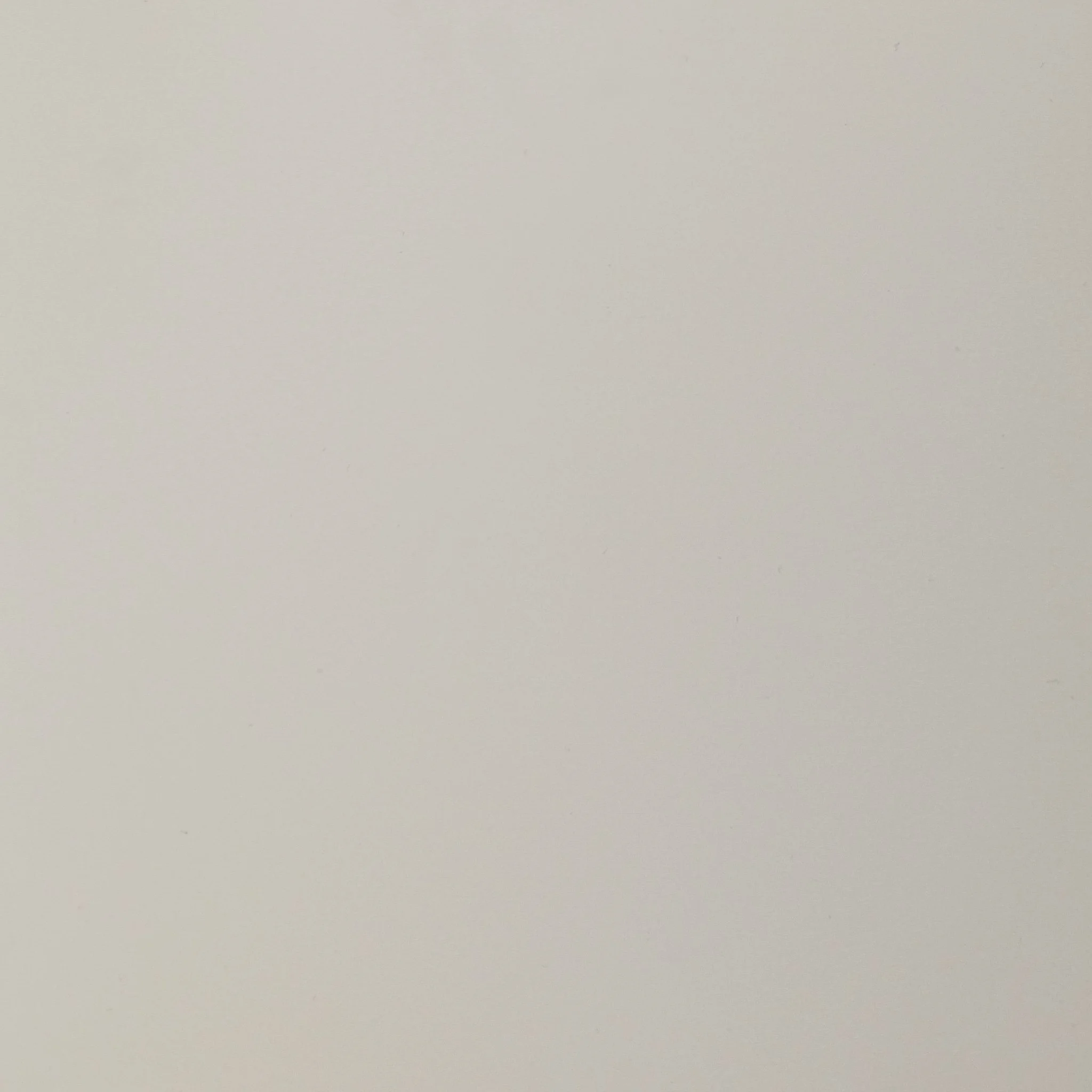 A blank plain white or off-white wall.