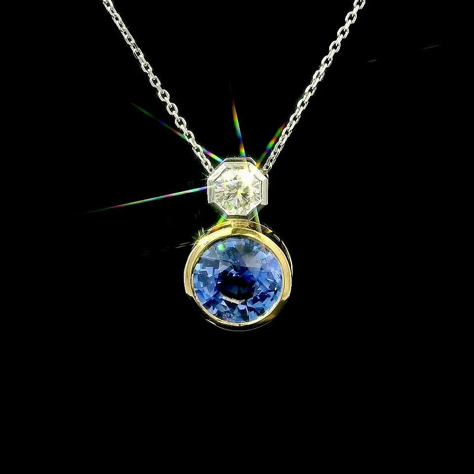 Take a look at this stunning 2.50ct round Sri Lankan blue sapphire set in 18ct yellow gold and perfectly accompanied by a GIA certificated octagonal brilliant cut diamond. The Octagonal diamond is 0.30ct F in colour and VVs1 in clarity and beautifull