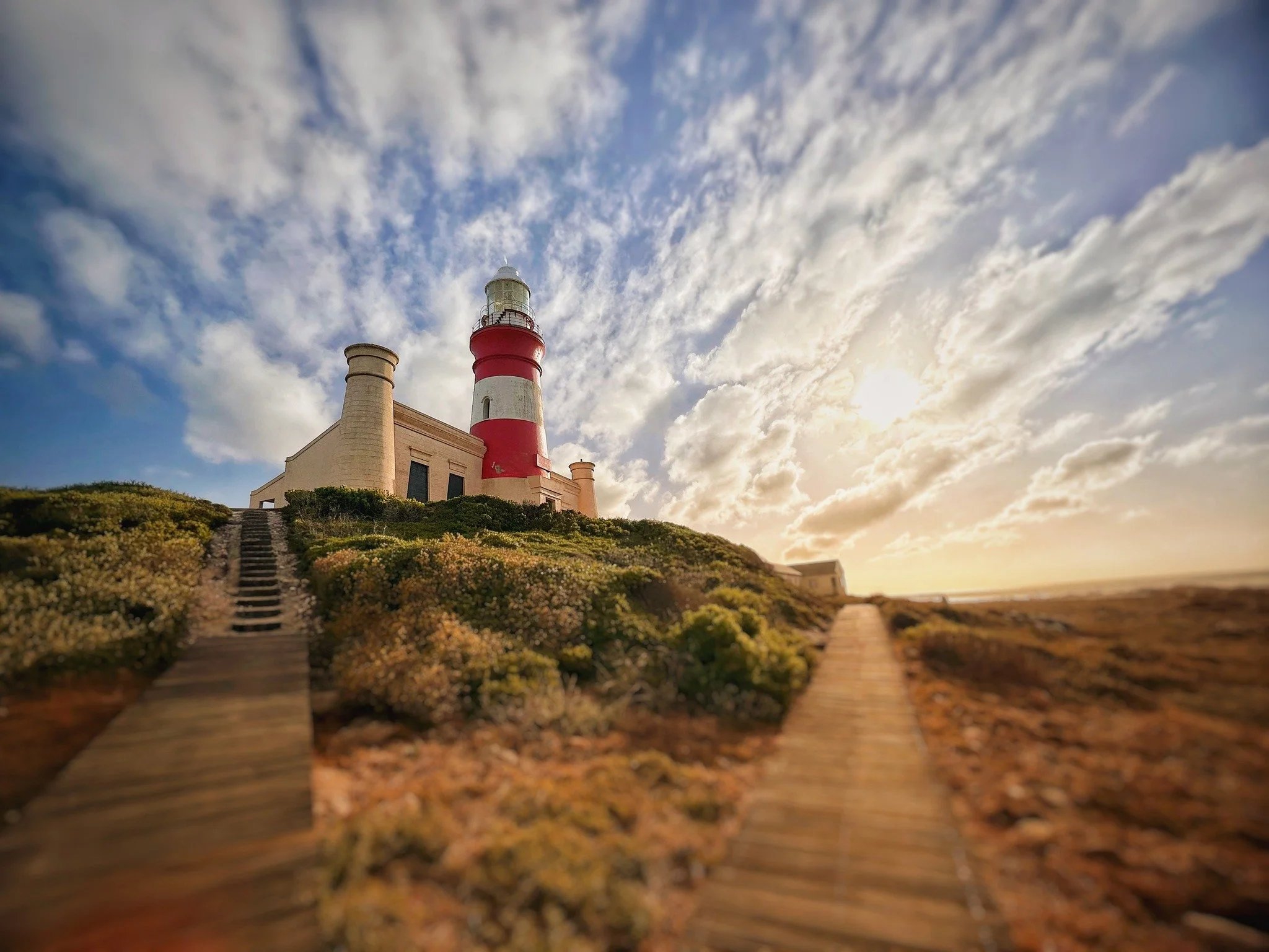 At the Southernmost Tip of Africa, the luxury isn&rsquo;t in the rush &mdash; it&rsquo;s in the pause.
Days begin with barefoot walks on Struisbaai&rsquo;s endless white beach and end with a glass of local wine as the Agulhas Lighthouse glows in the 