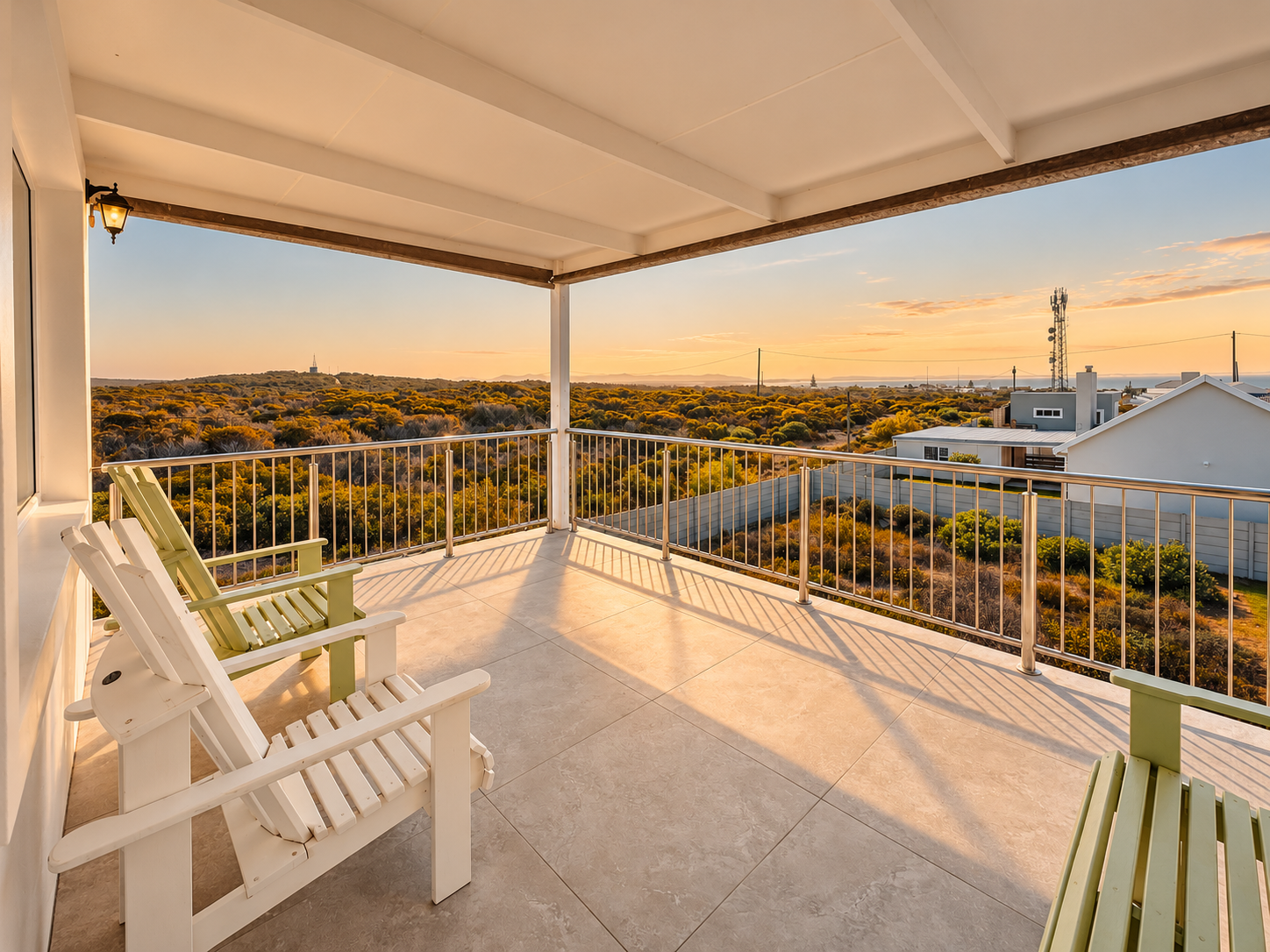 Covered balcony with rocking chairs and fynbos views