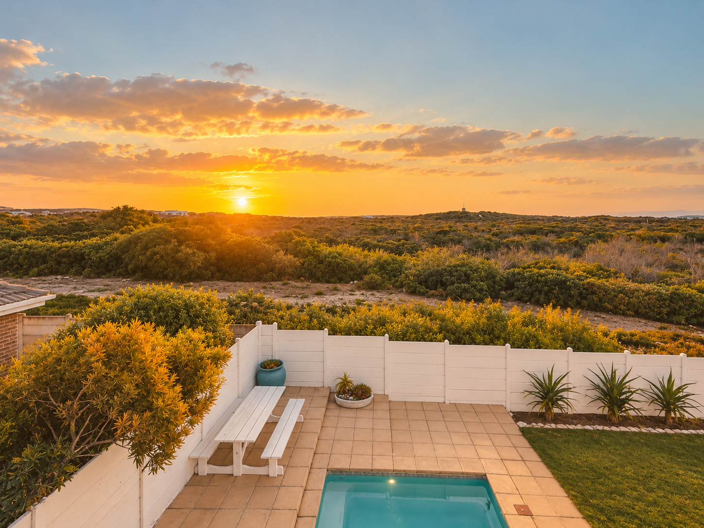 Pool terrace overlooking fynbos at sunset