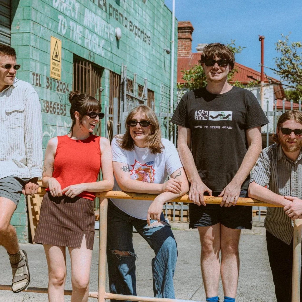 Delivery band standing in front of wall in Melbourne