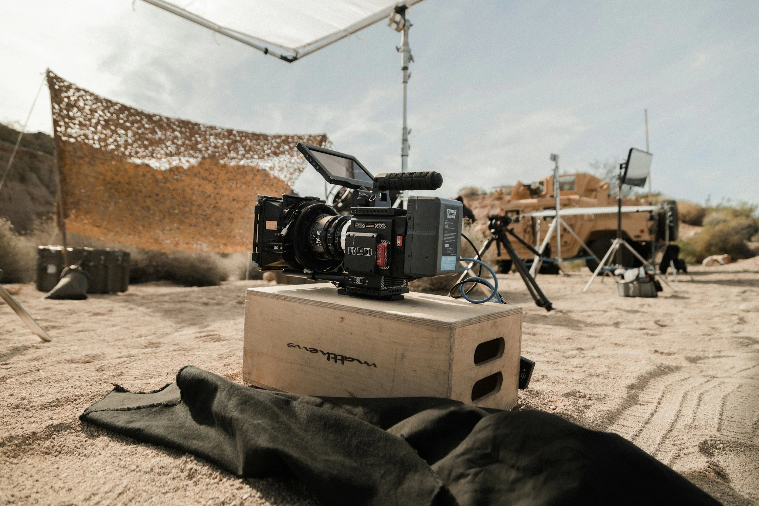 RED video camera set on a wooden box with filming equipment on location, representing filming day support, fixer services, and on-set coordination in Croatia by ViEdo.