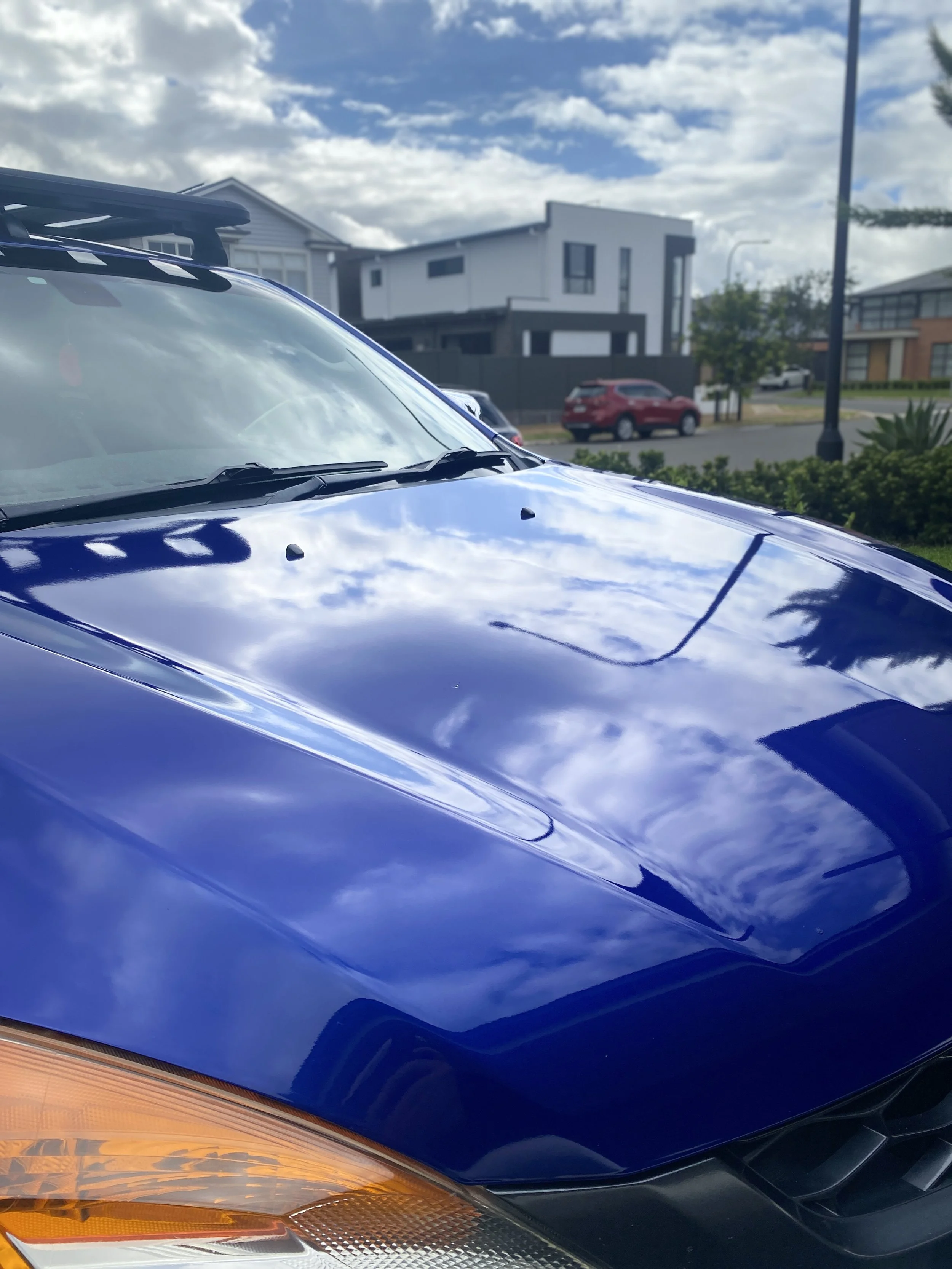 High gloss ceramic coating after paint correction on a blue Mazda BT-50 in Northwest Sydney, NSW