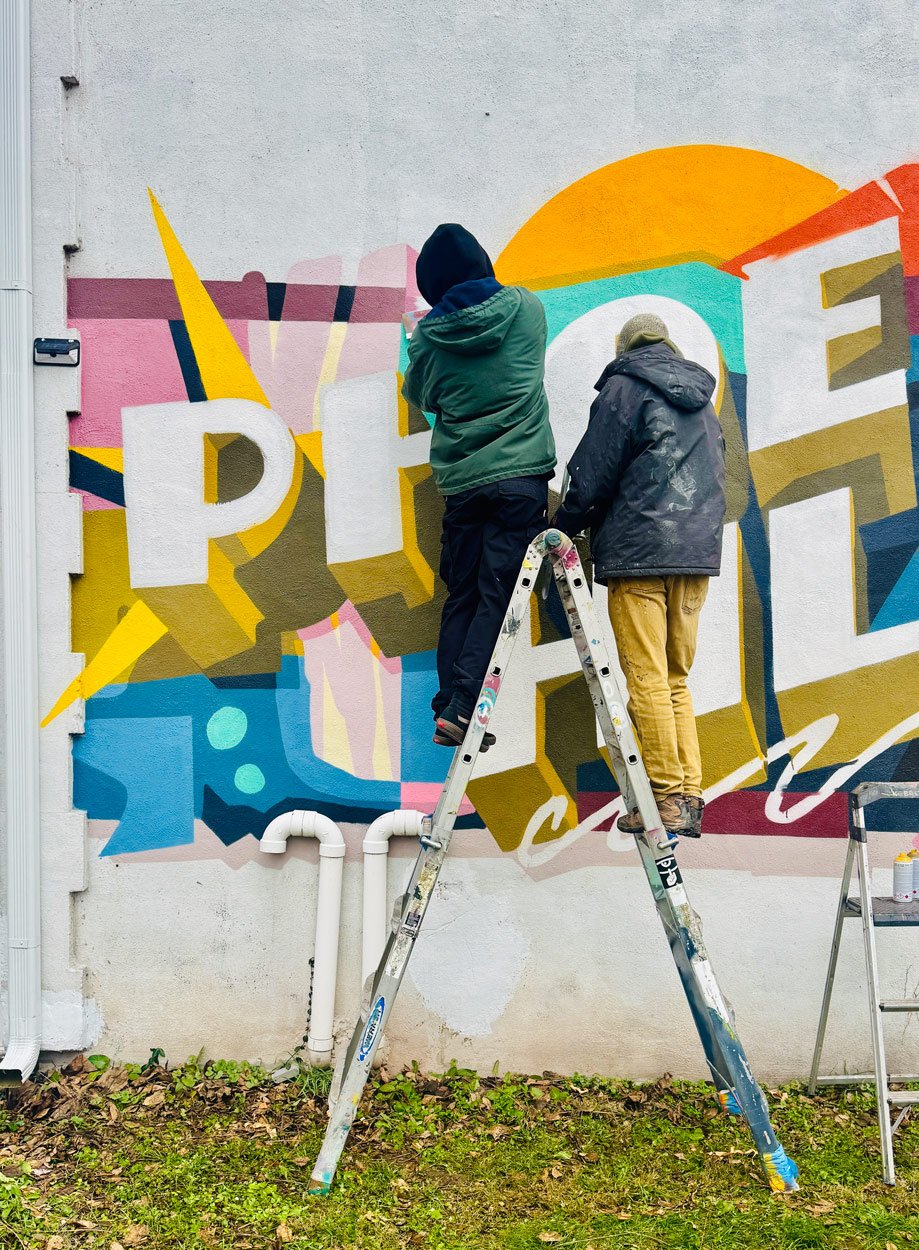 Progress shot of an exterior mural on an Airbnb in the Phoenix Hill neighborhood of Louisville, Kentucky