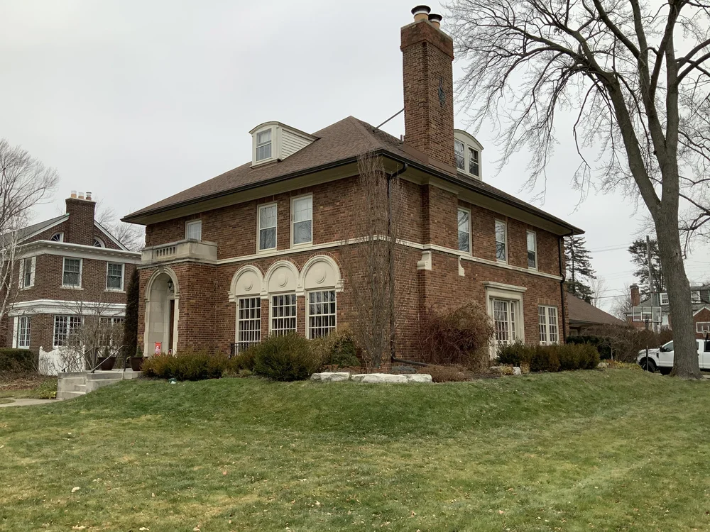 Professional insulation installation by NEXT Exteriors in Oakland County Michigan showing proper attic ventilation