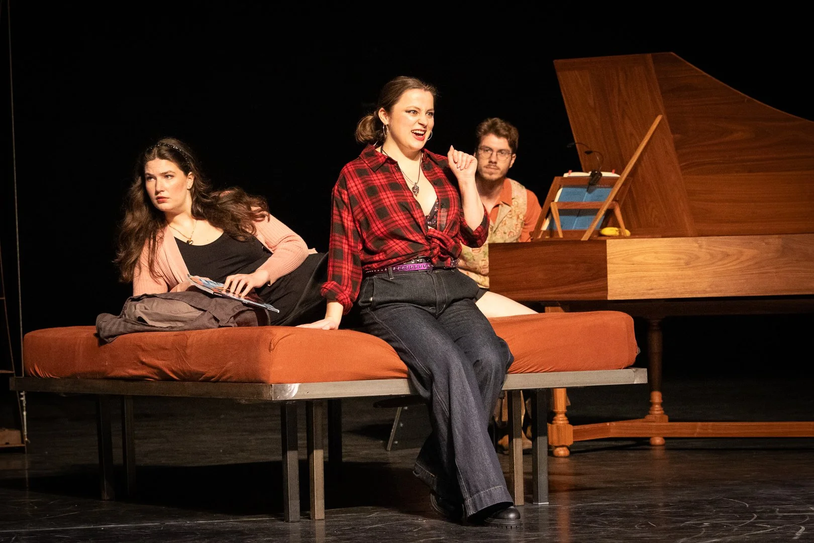 Despina, sat on a bed