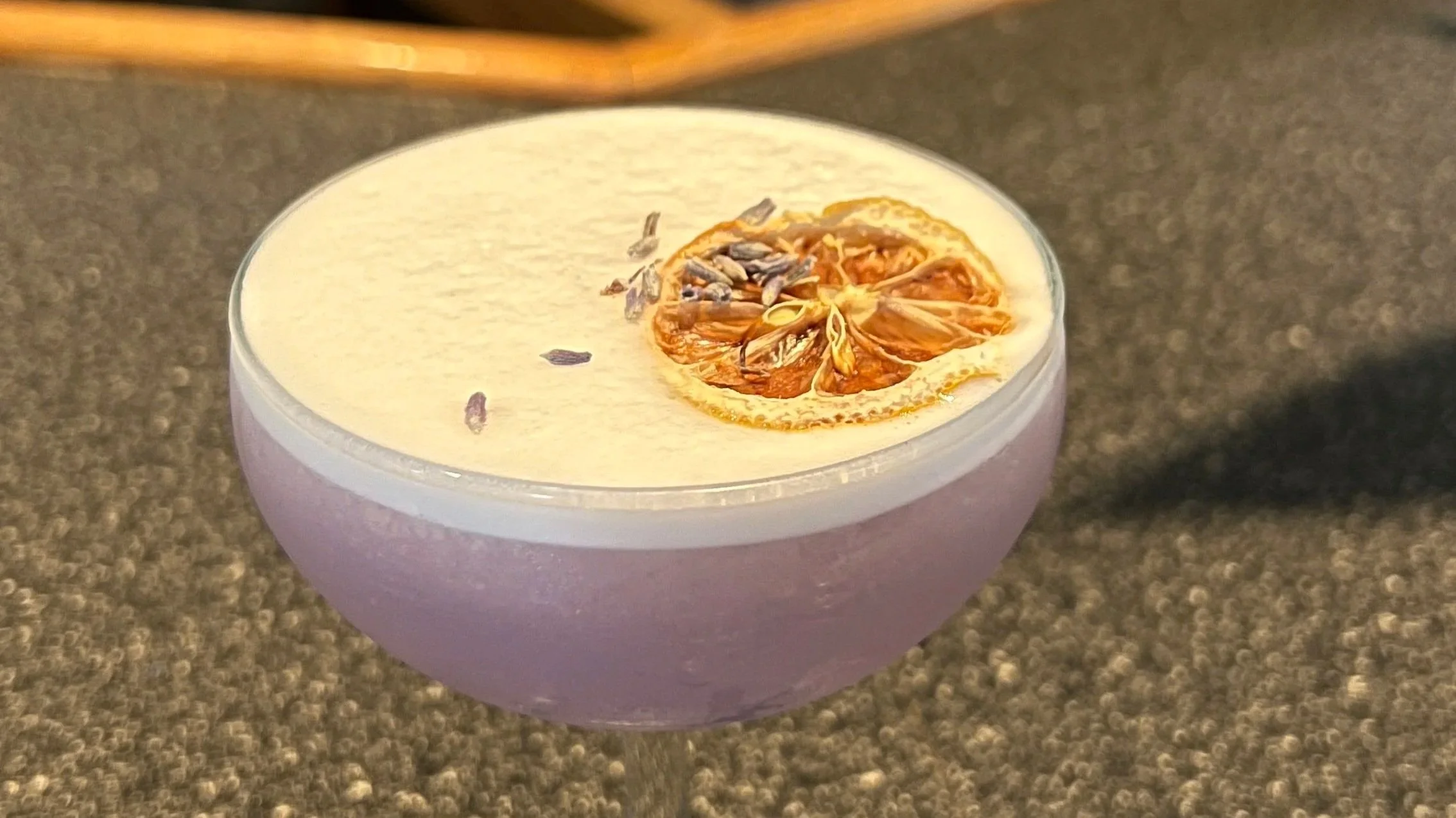the social butterfly, a new cocktail for spring, garnished with lavender and orange