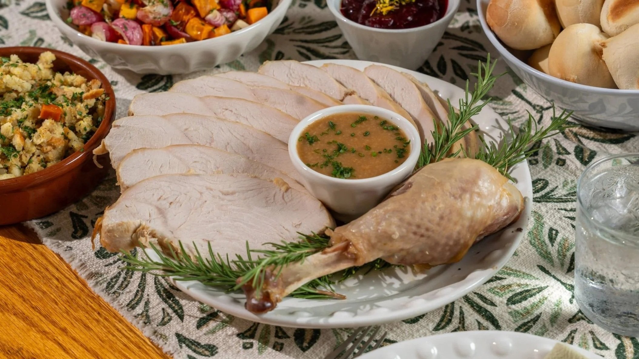 Classic turkey entree with turkey gravy and rosemary sprigs.