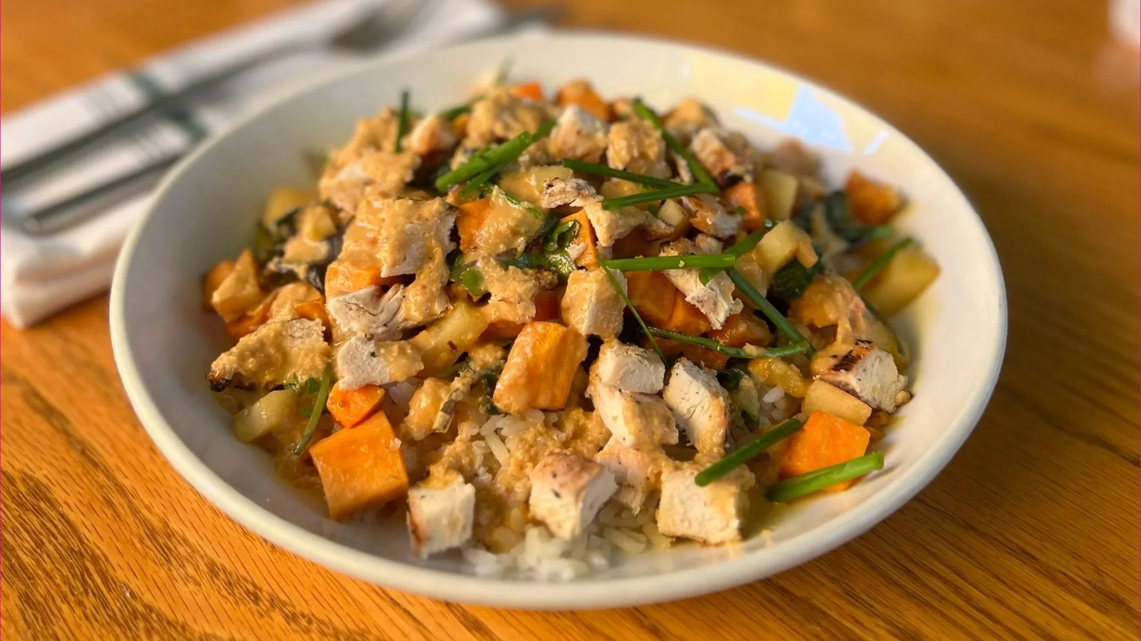 Warm Harvest Bowl: grilled chicken, sliced apple, roasted sweet potato, rice, kale, lemon tahini dressing (gluten free, vegan option)