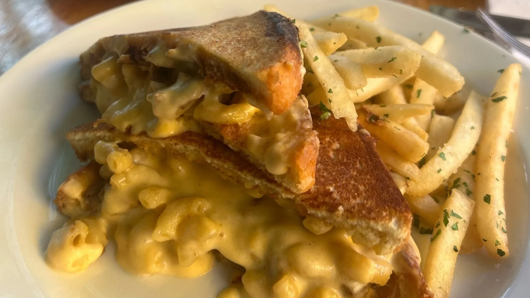 Pulled Pork and Mac & Cheese Panini:
kalua style pulled pork, creamy mac and cheese, sharp white cheddar, NC style bbq sauce on brioche toast