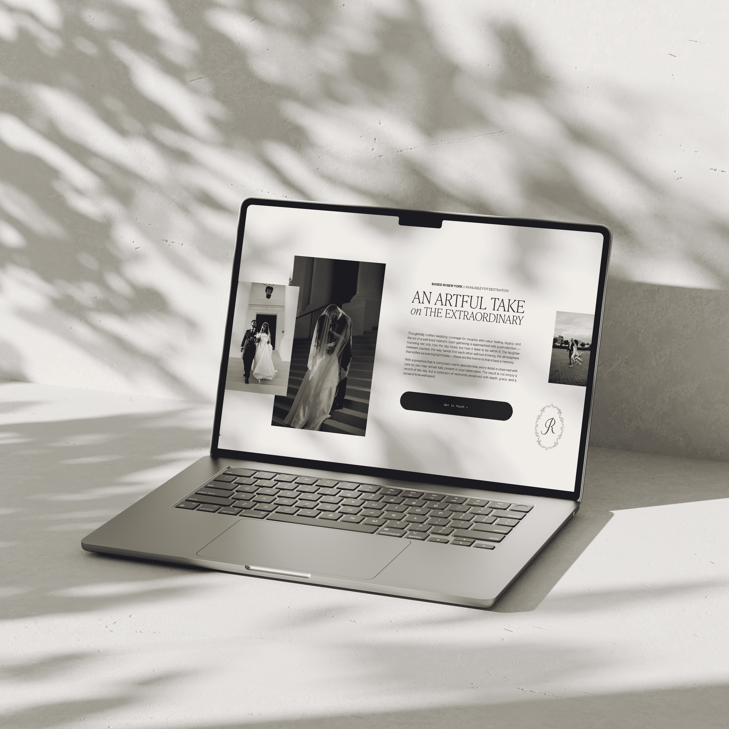 Macbook laptop with editorial, romantic website layout for a wedding professional