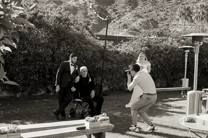 Lalo photographing groom with father at Casa Cody Palm Springs wedding weekend shot on 35mm film