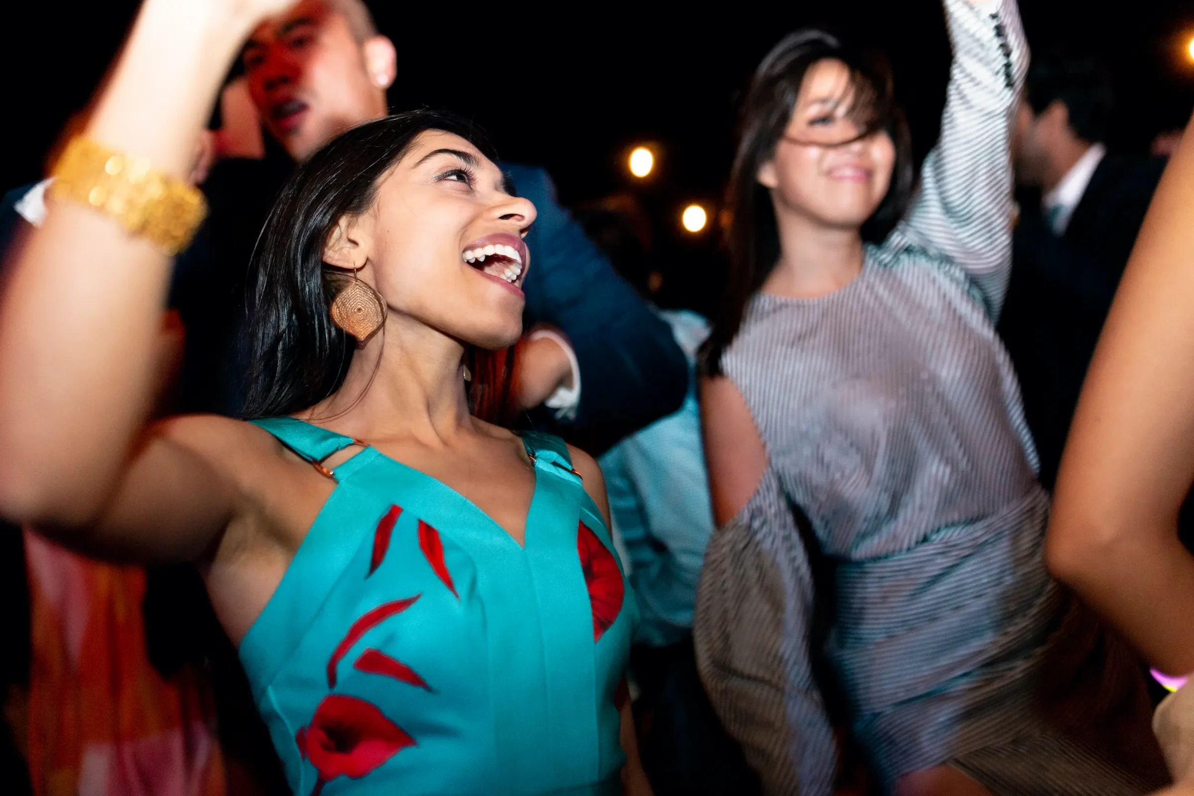Guest dancing at the wedding reception at Hummingbird Nest Ranch in Santa Susana, California, photographed on 35mm film with flash.