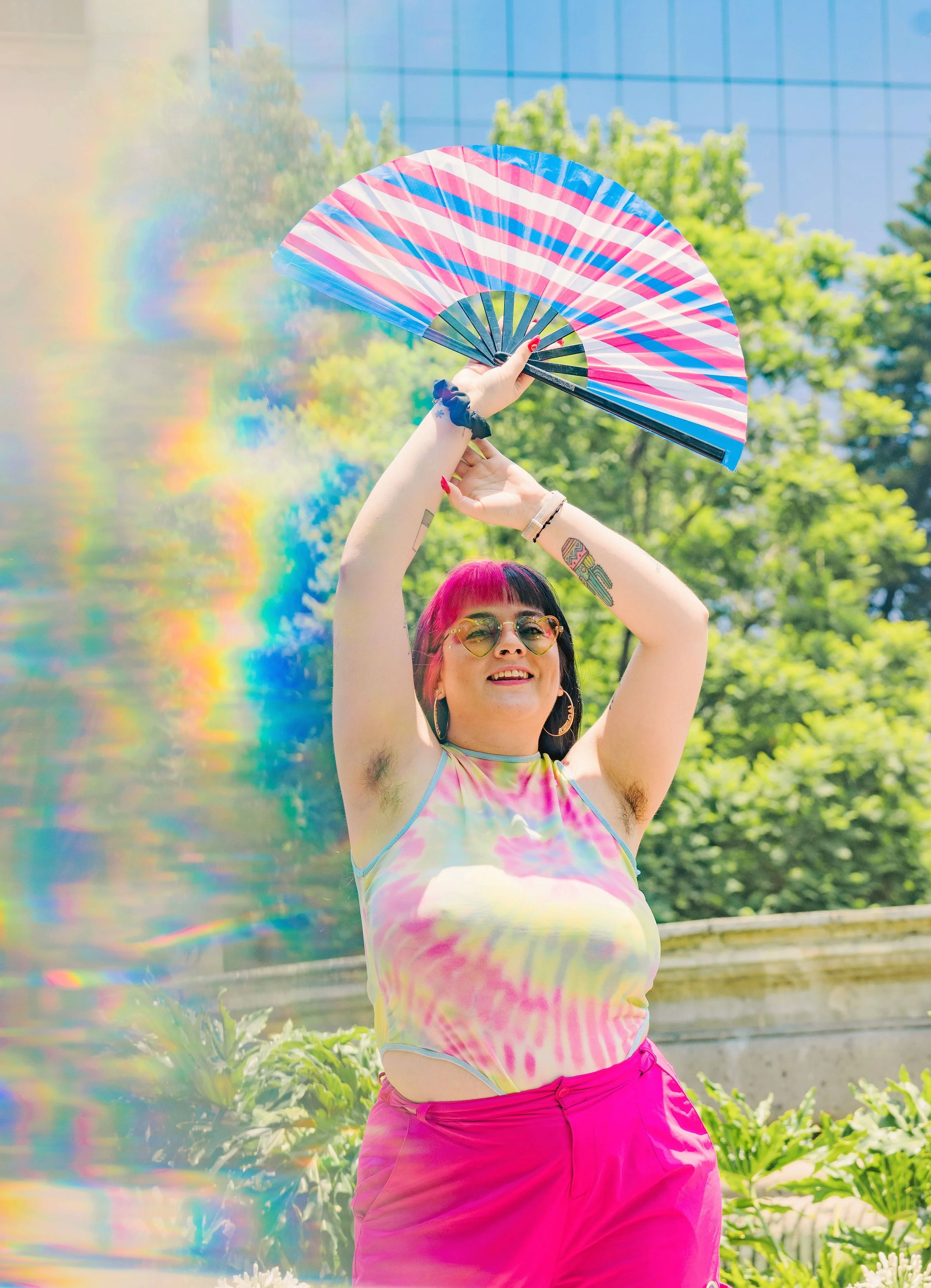 Genderqueer genderfluid adult showing off trans pride as they seek integrative therapy services in Oakland and online throughout San Francisco Bay Area and California