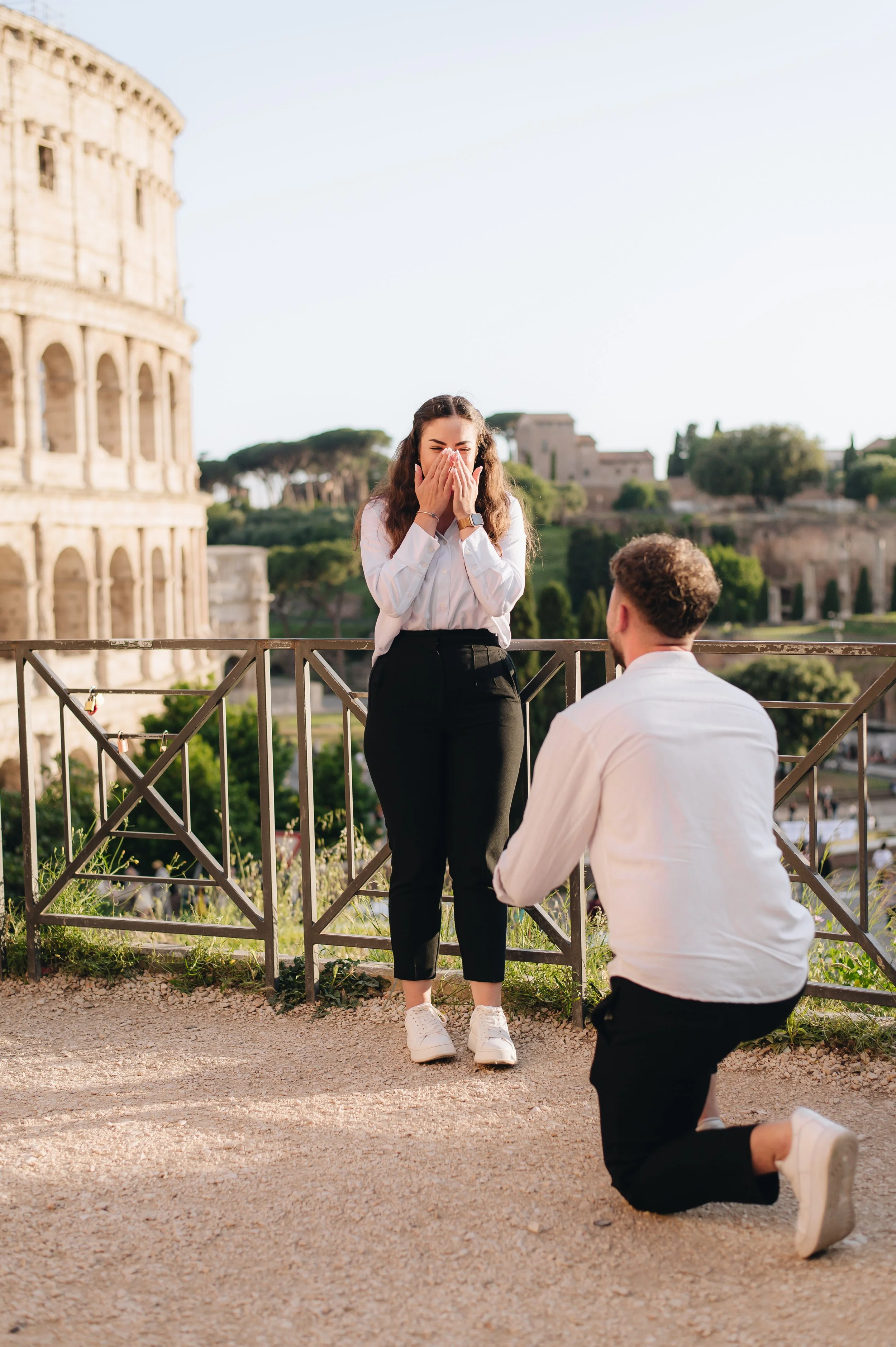 Surprise proposal in Rome near Colosseum, emotional moment