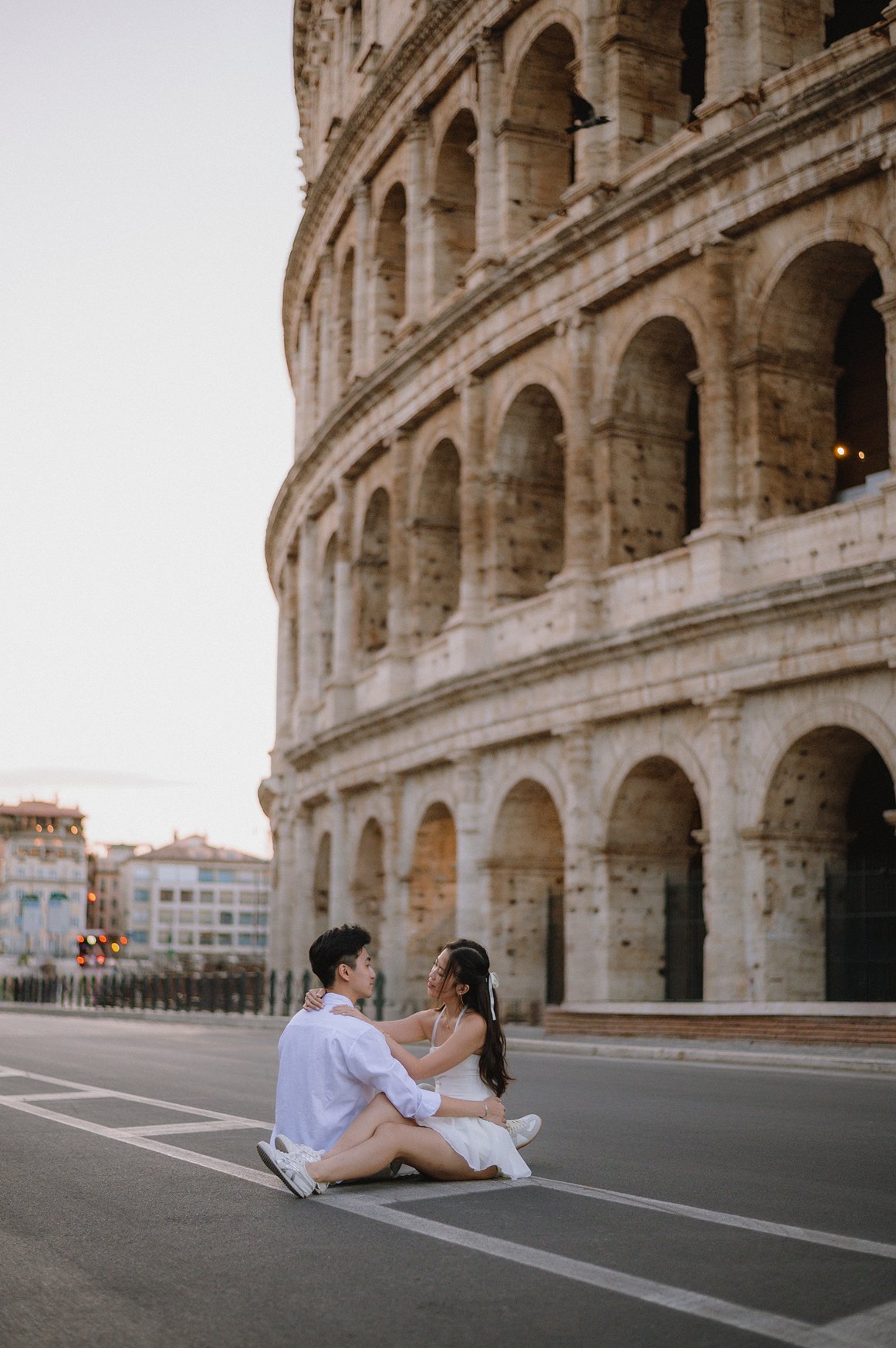 Cinematic couple photoshoot in Rome near the Colosseum at sunrise
