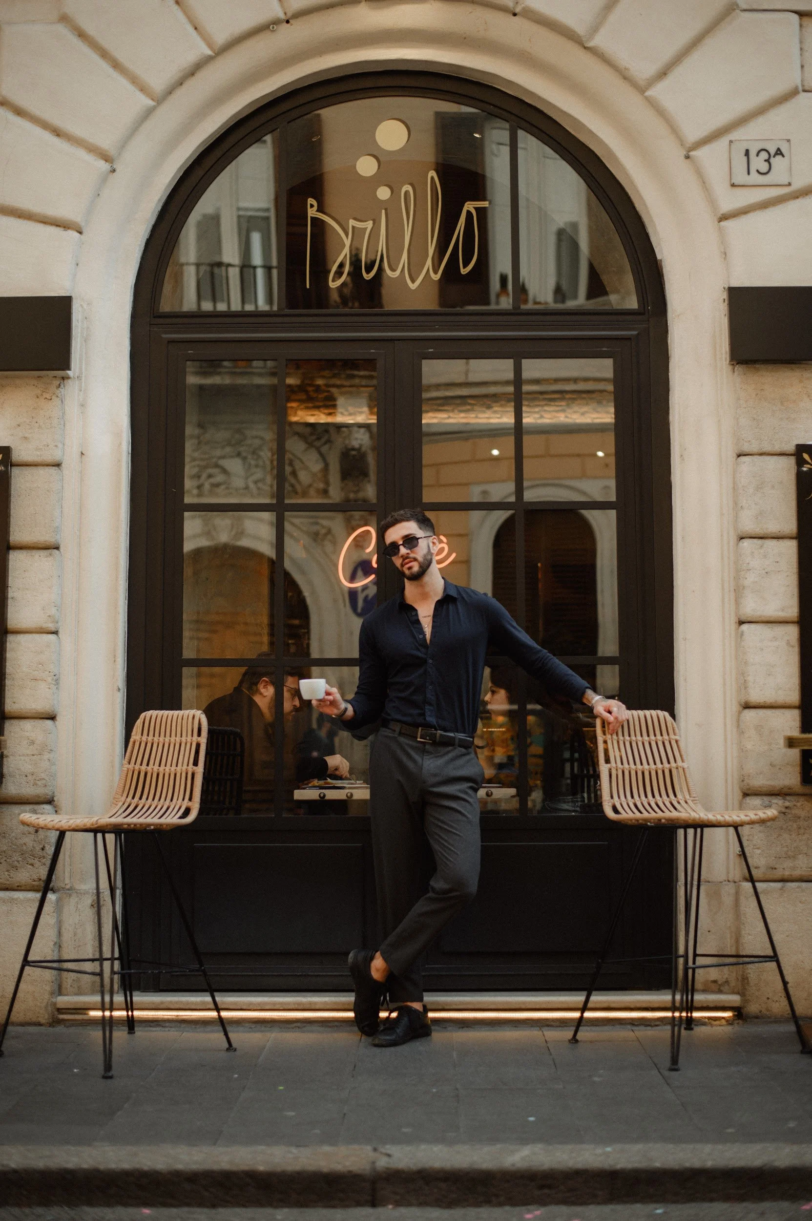 Candid moment outside a café in Rome capturing everyday Italian atmosphere during the shoot