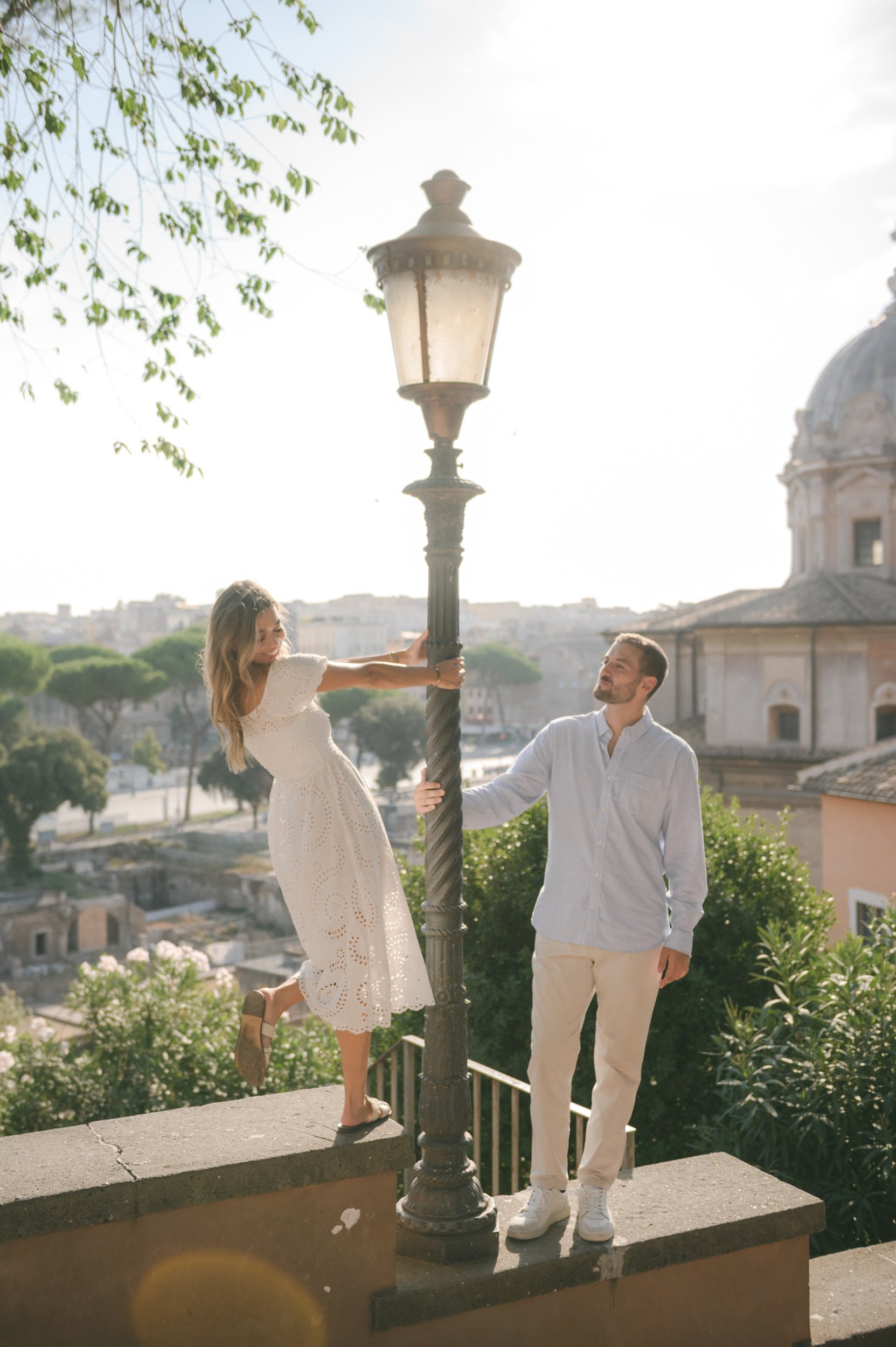 Engagement photoshoot in Rome overlooking the city with soft golden light