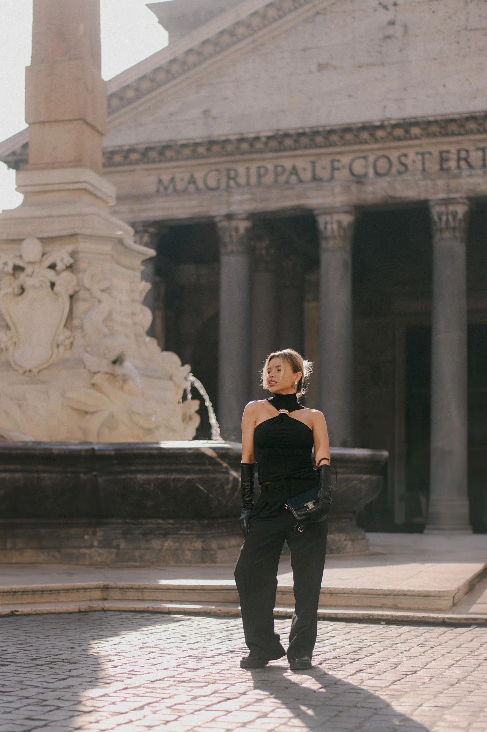 Cinematic portrait of a woman in black near the Pantheon in Rome with soft natural light