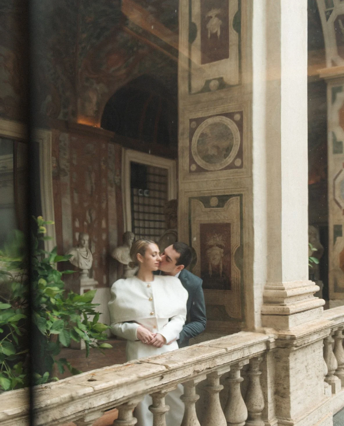 elegant couple in Palazzo Altemps Rome during romantic engagement photoshoot