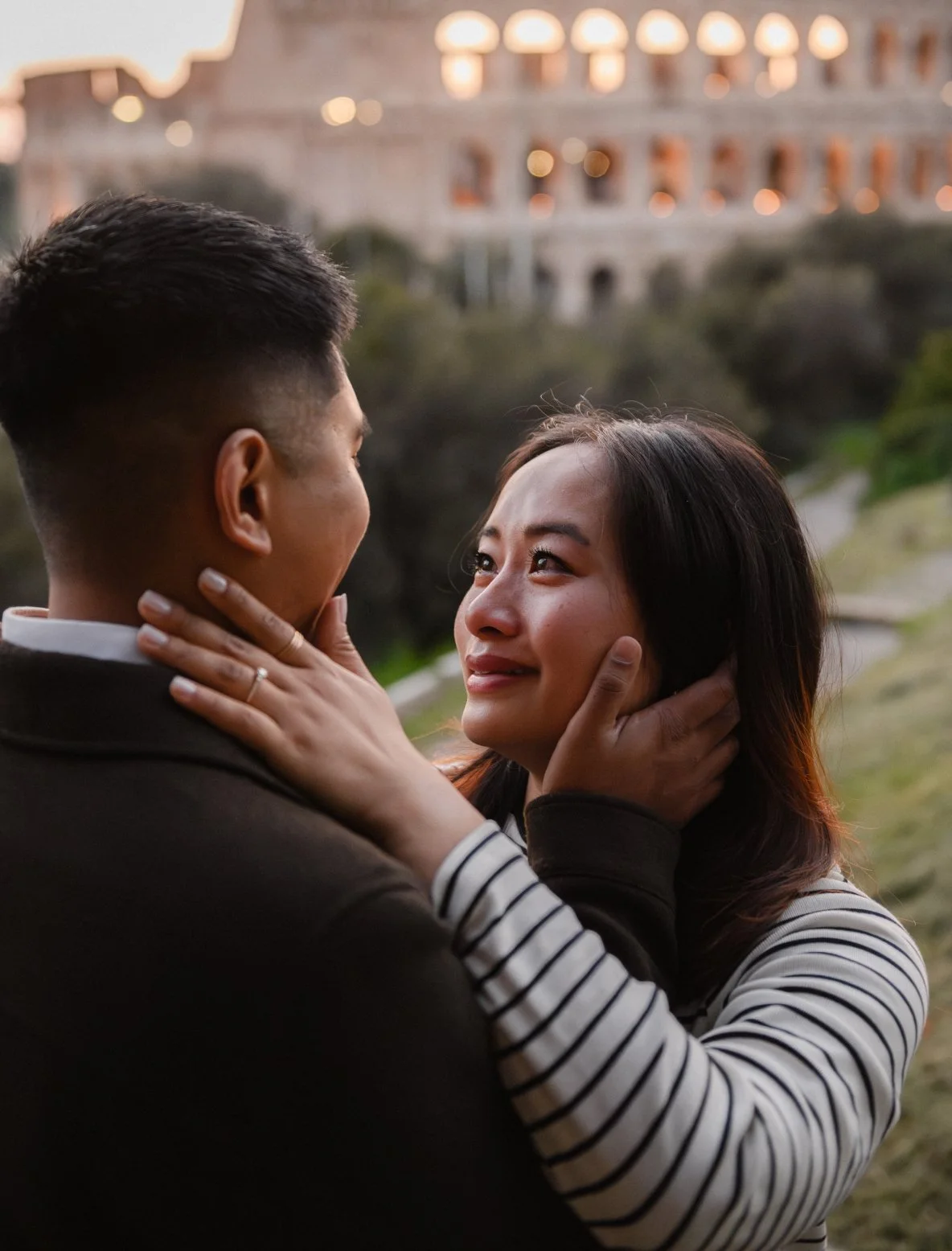 romantic couple embracing in Rome Colosseum engagement photoshoot Italy