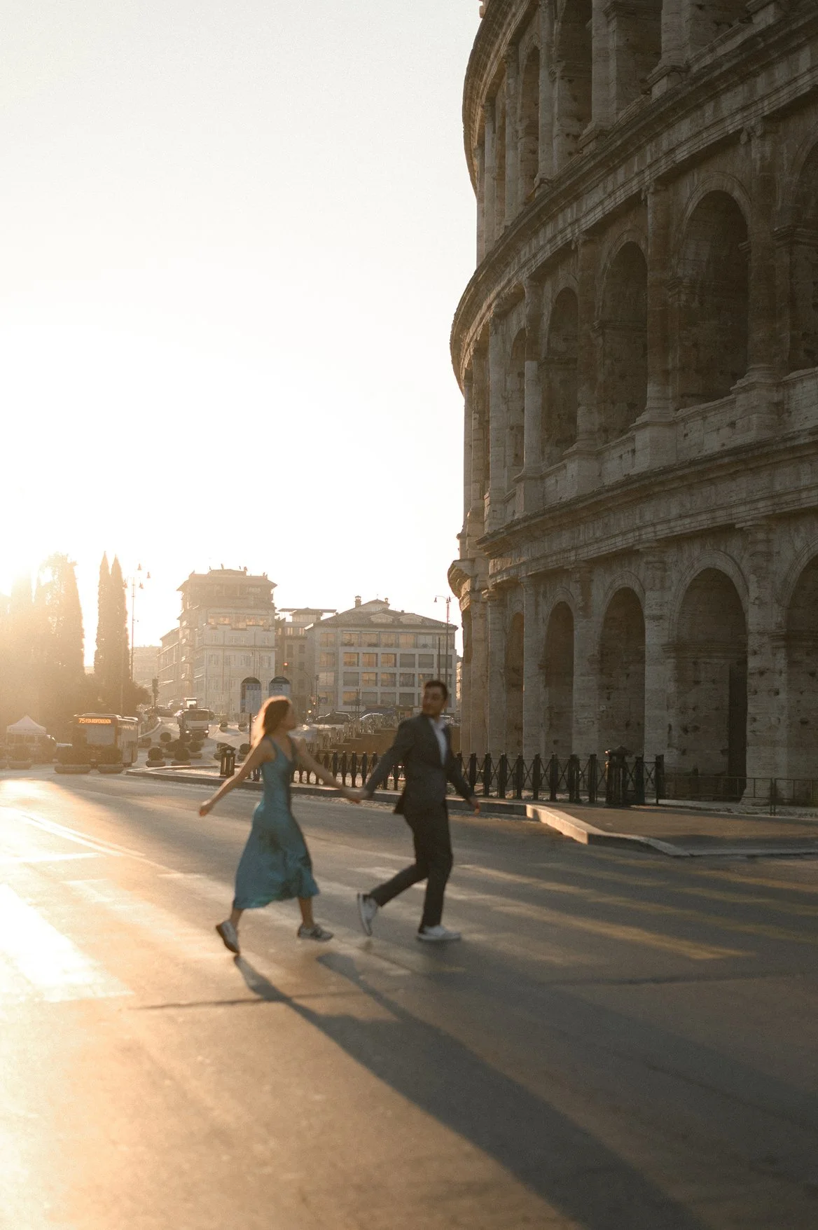 Romantic couple photoshoot at the Colosseum in Rome during golden hour
