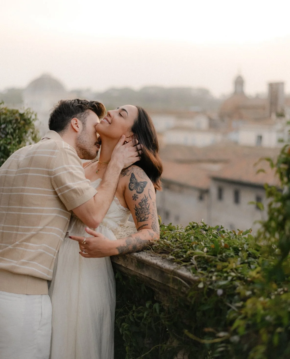 Romantic couple photoshoot on hidden terrace in Rome at sunrise