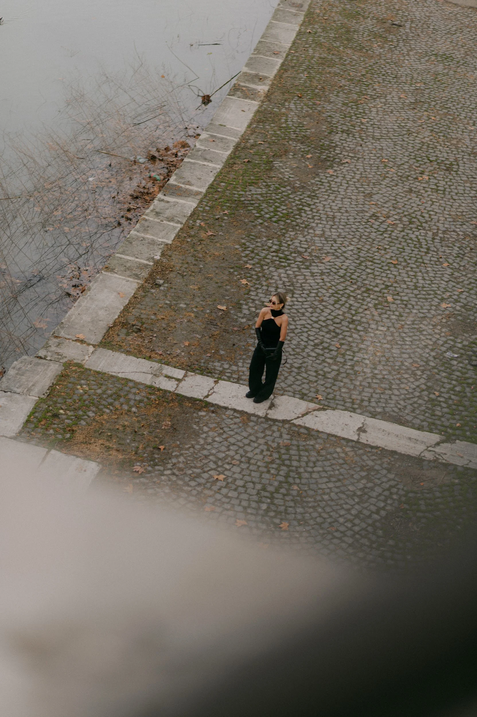 Cinematic wide shot at Ponte Sant Angelo in Rome with Castel Sant Angelo in the background