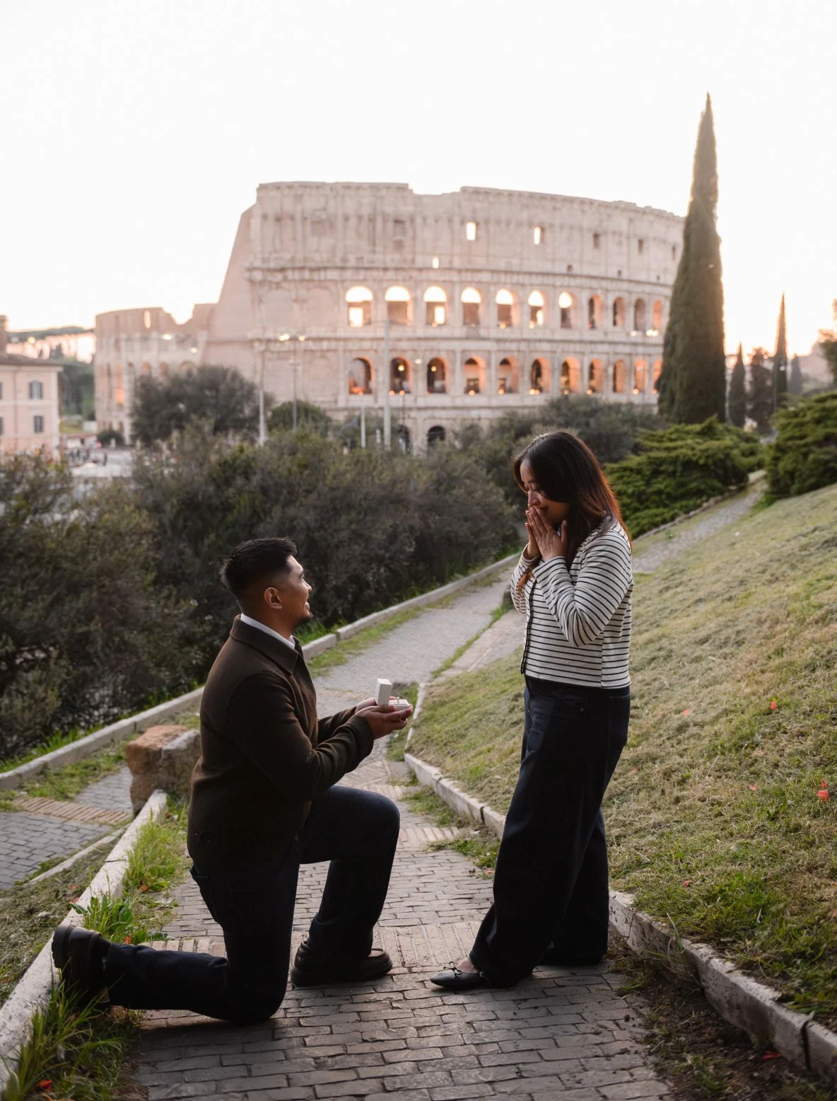 Surprise proposal in Rome at Colosseum romantic engagement moment Italy