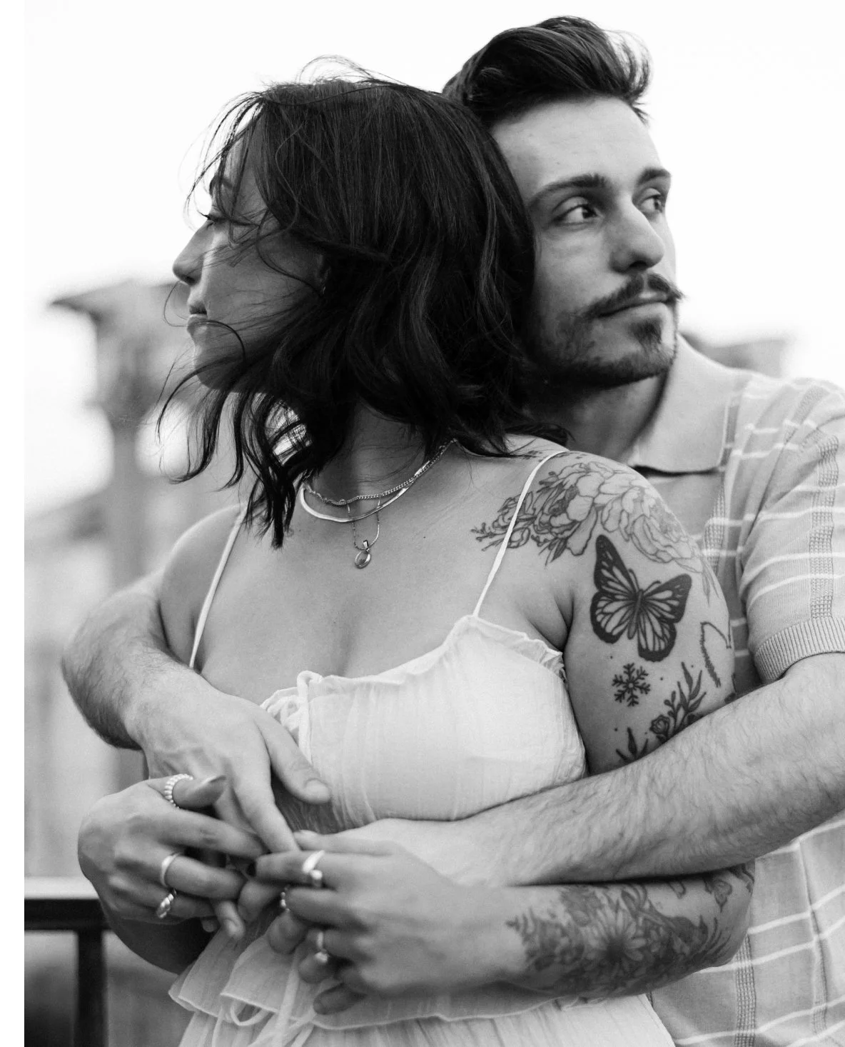 Black and white couple embracing, emotional candid moment in Rome photoshoot