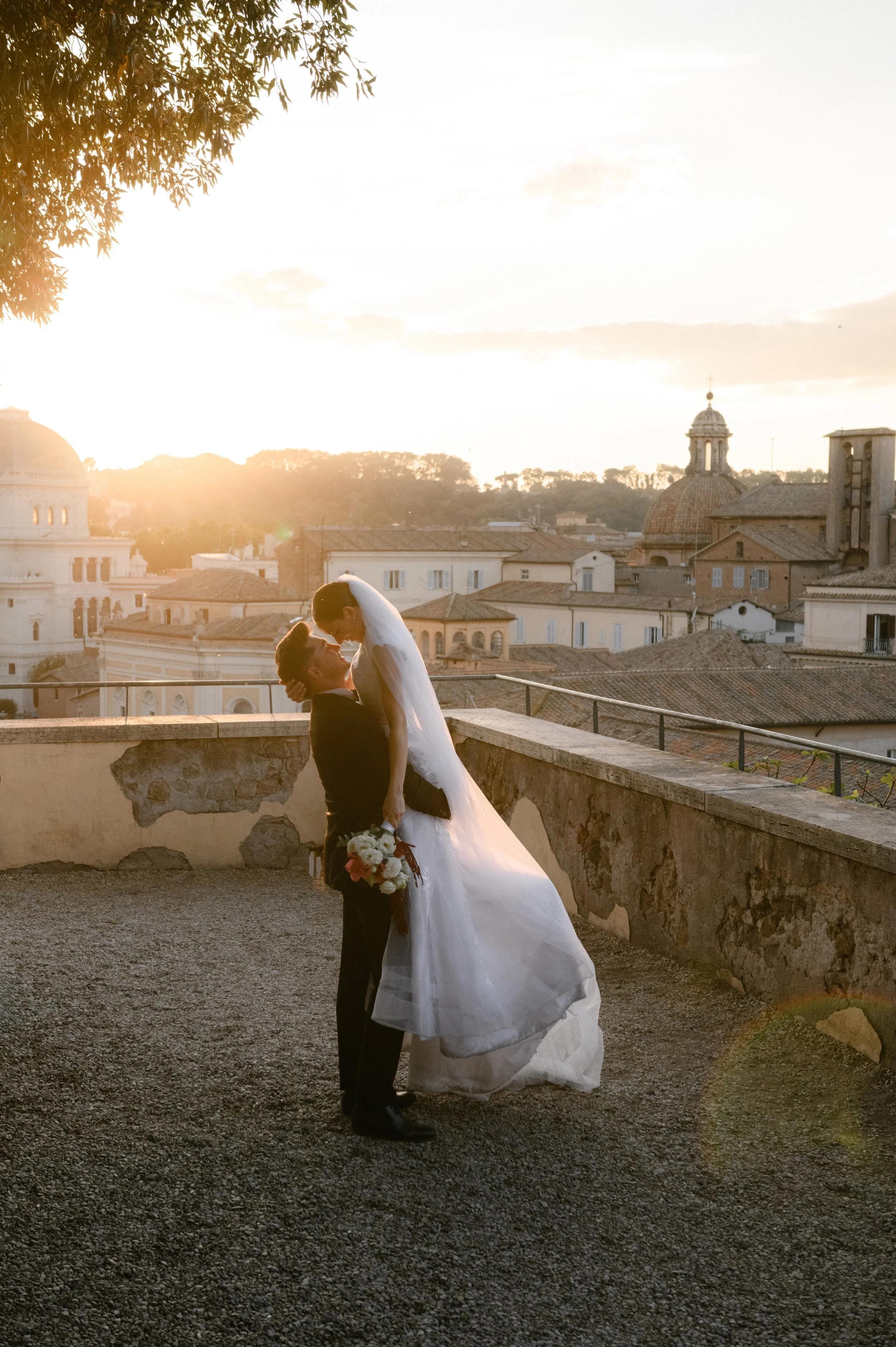Wedding photoshoot in Rome at sunset with city view