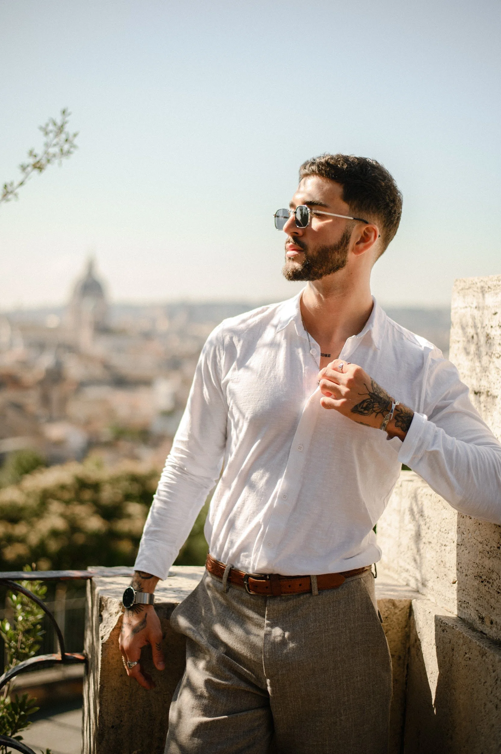 Cinematic portrait of a man in Villa Borghese overlooking Rome with a relaxed elegant mood