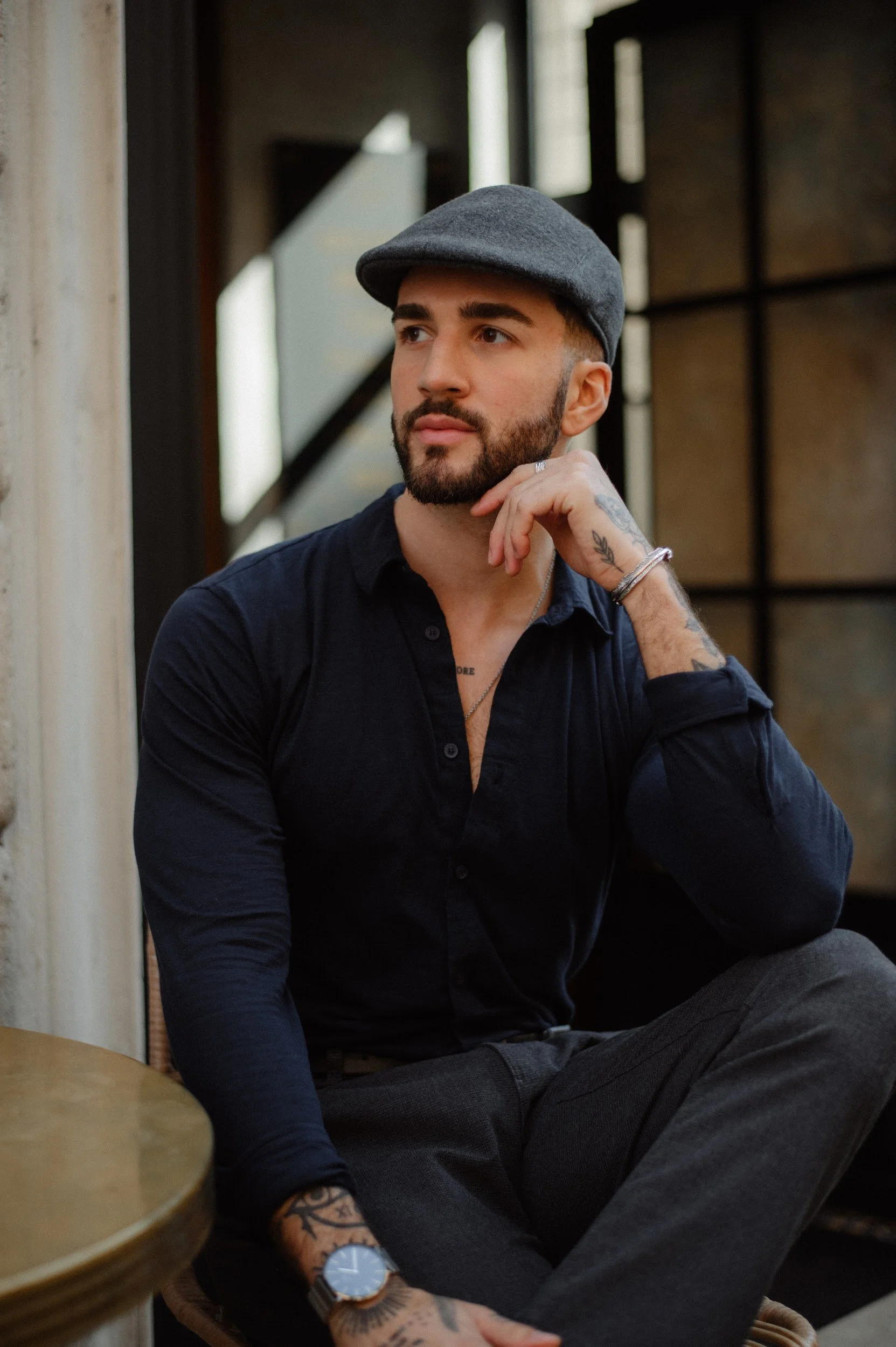 Candid portrait in Rome with a man in a relaxed modern style and natural light