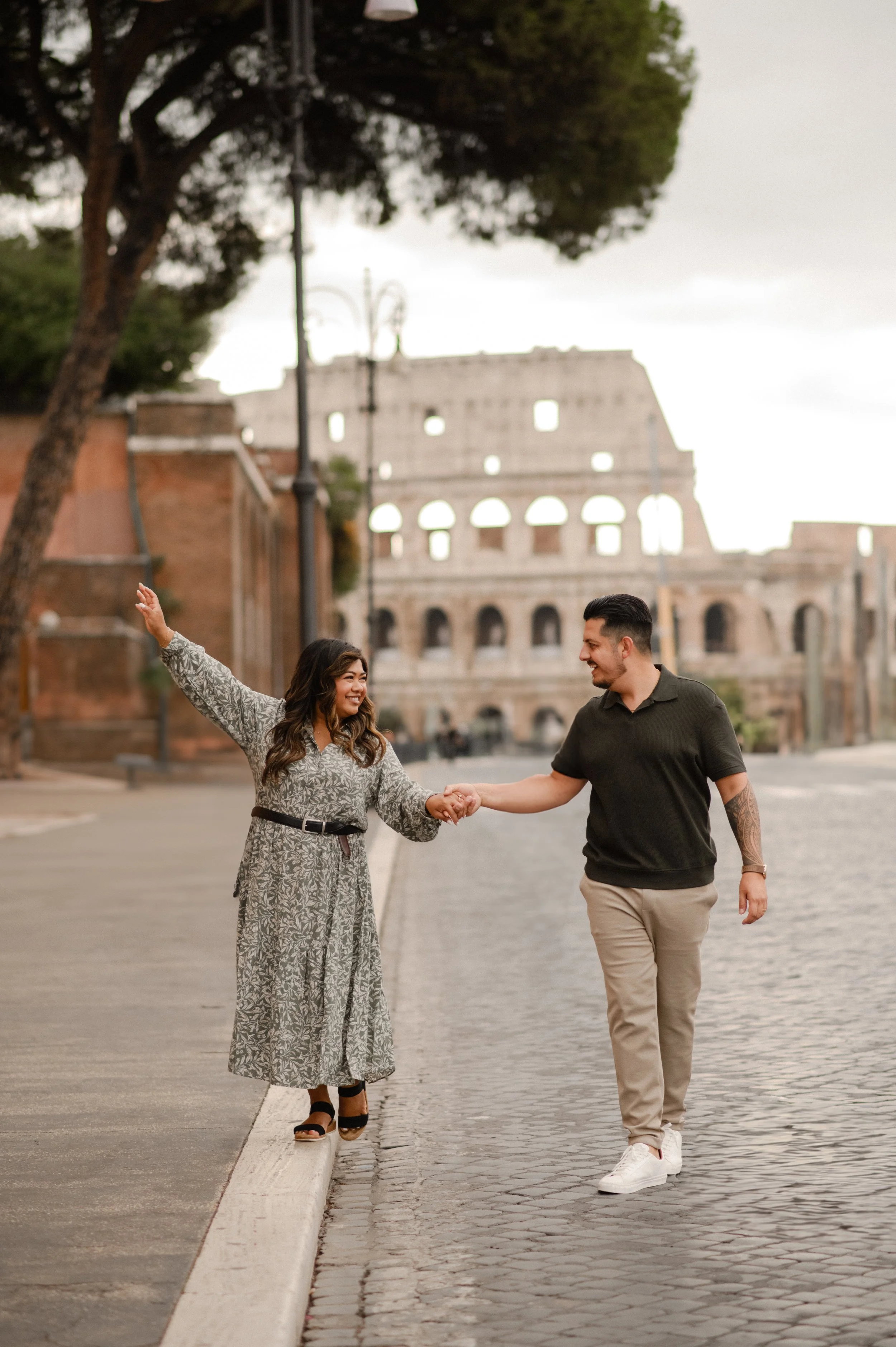 Couple walking near Colosseum in Rome photoshoot