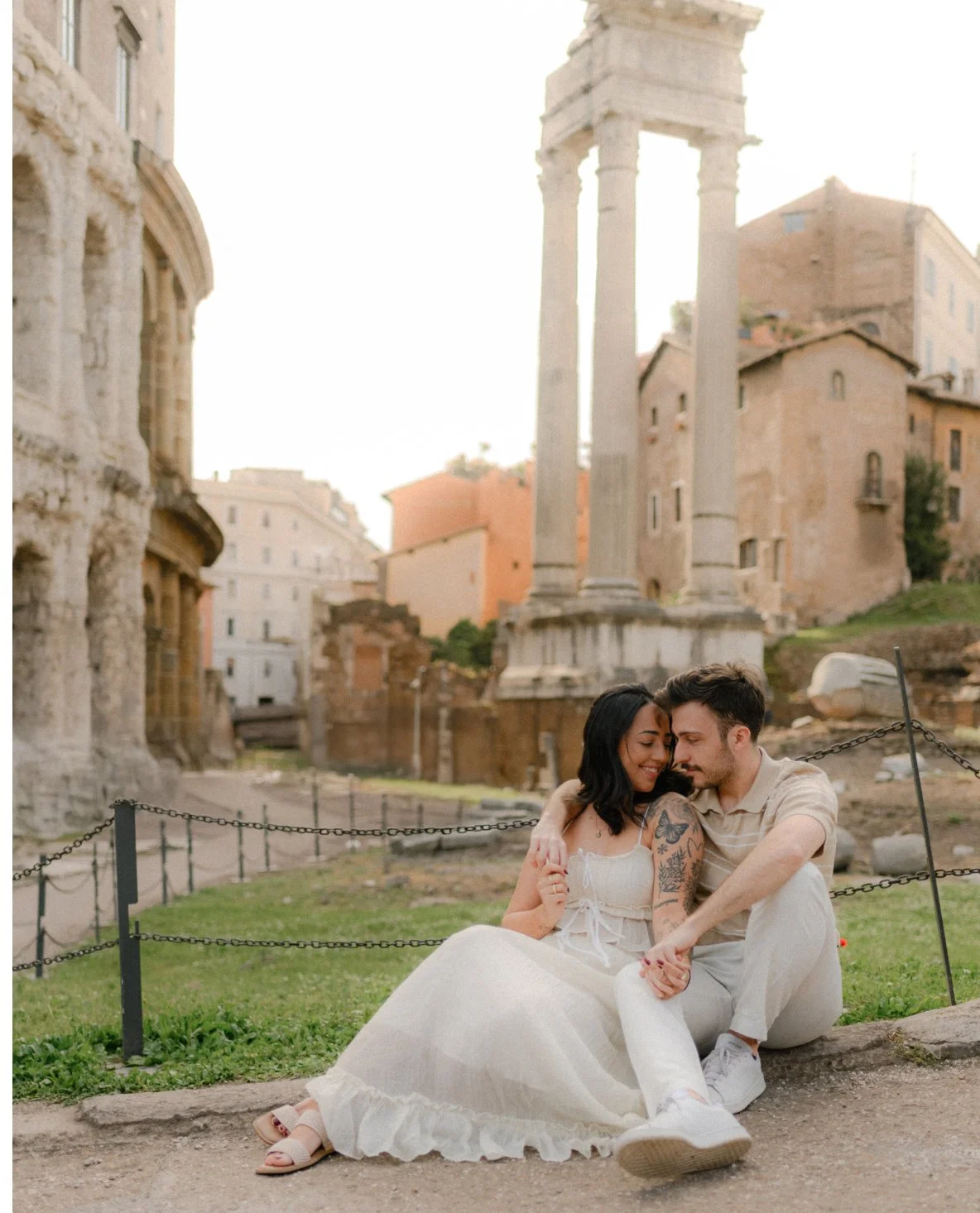 Couple sitting and hugging near Teatro di Marcello Rome, candid couple photoshoot