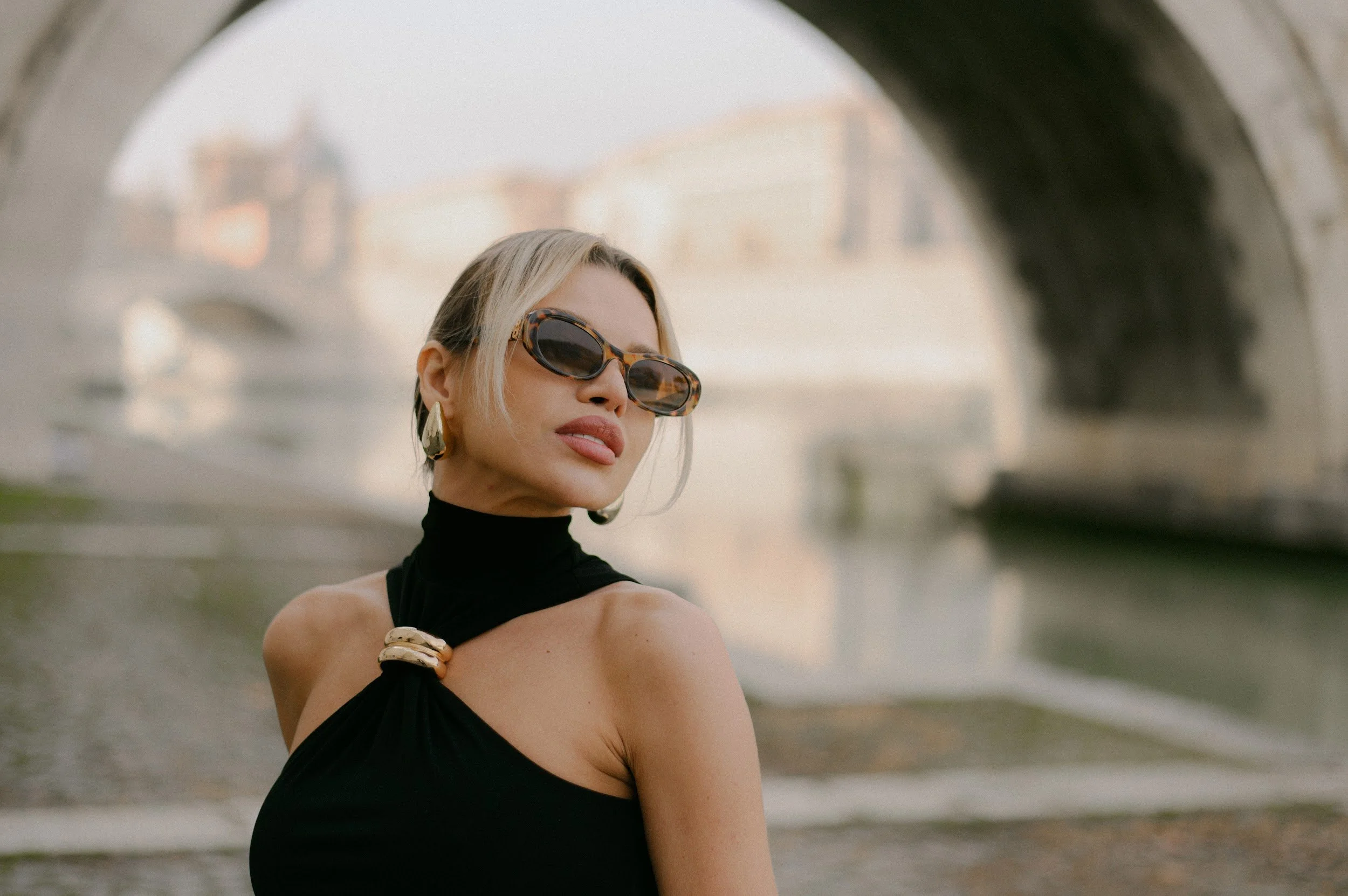 Close up portrait near Ponte Sant Angelo in Rome with soft cinematic light