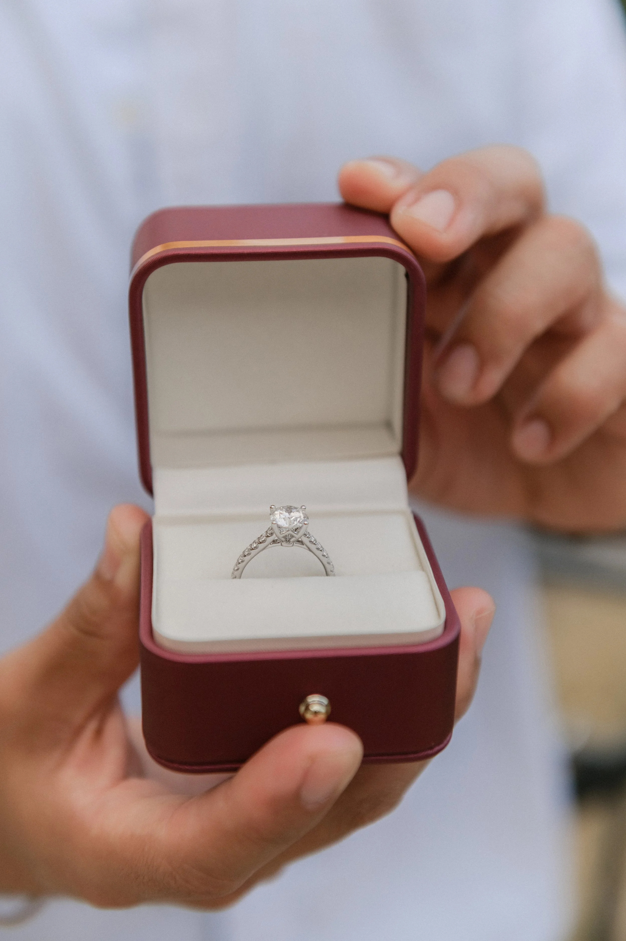 Engagement ring in a box during a surprise proposal in Rome, Italy. Romantic proposal photography in Rome.