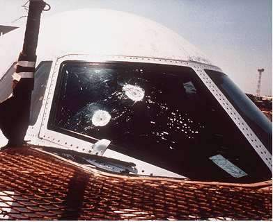 Mysterious bullet-marks in the cockpit windscreen, as seen the following day