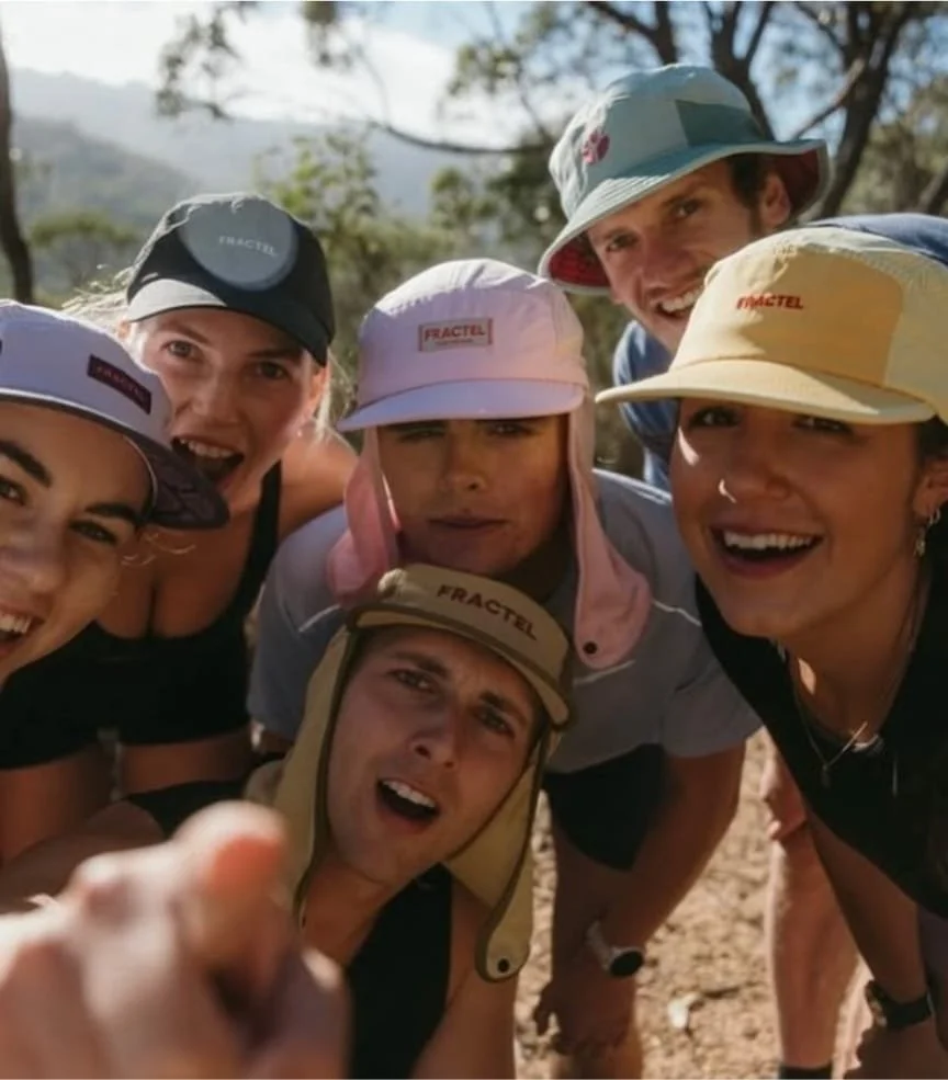 Group of people wearing Fractel hats