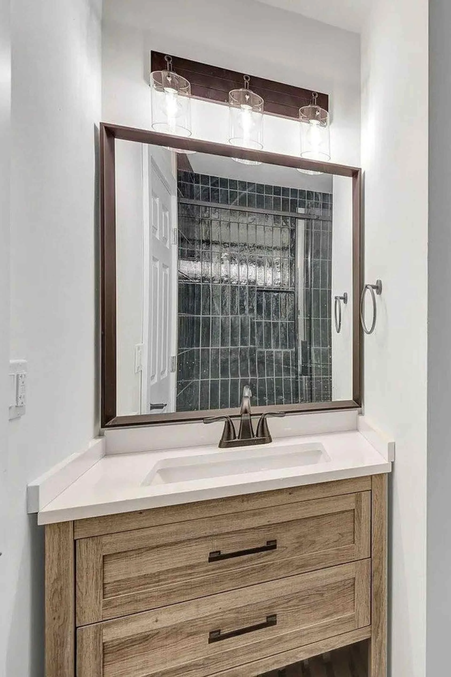 Bathroom Remodel including drywall, cabinet, lighting, and fixtures