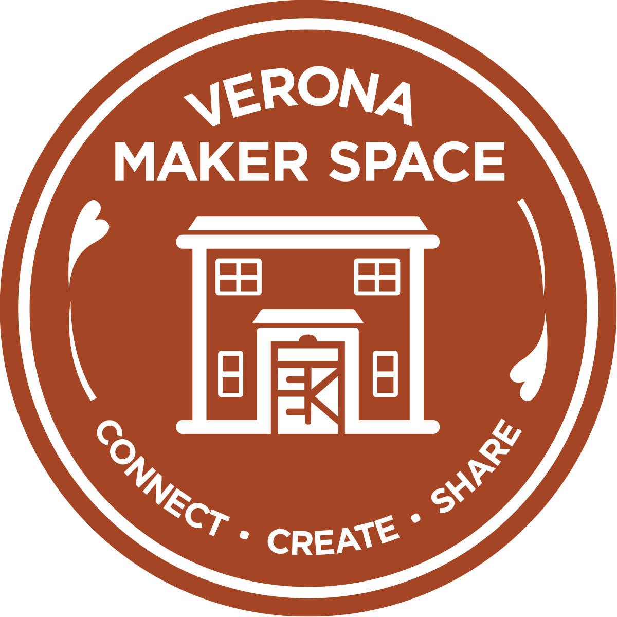 A brown circular badge with white text and graphics. It reads 'Verona Maker Space' at the top and 'Connect Create Share' at the bottom. The center features an outline of a two-story building with a garage door.