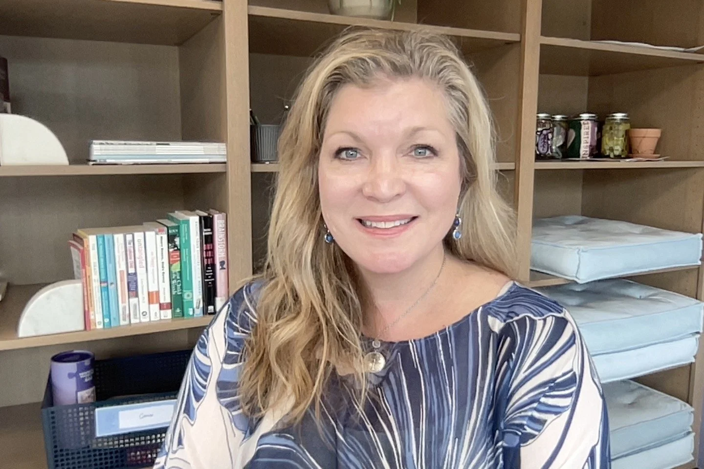 Crystal sphere reflecting rainbow colors on a white surface.